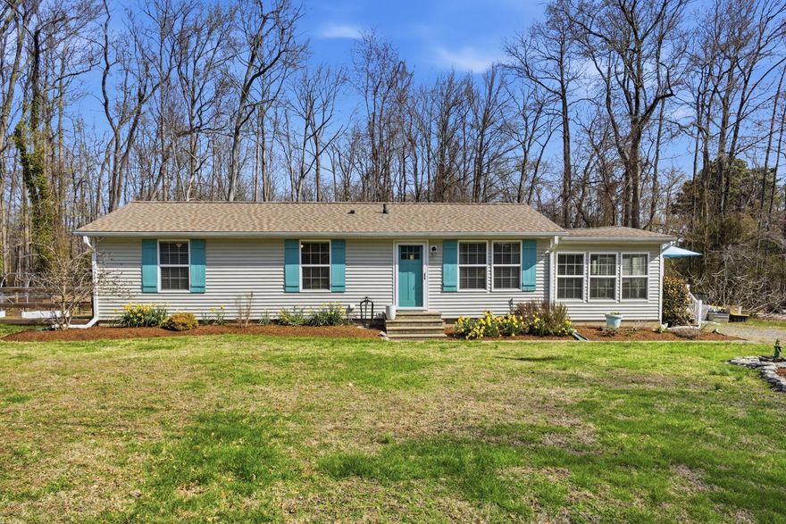 Welcome to this beautifully updated 3-bedroom, 1.5-bath rancher offering 1,344 sq ft of comfortable, energy-efficient living. Thoughtfully improved since 2018, this home blends modern upgrades with inviting indoor and outdoor spaces.

Step inside to find newer laminate flooring, updated baseboards, and a fully remodeled kitchen featuring soft-close cabinetry, butcher block countertops, and stainless steel appliances. The spacious sunroom is a true highlight, complete with new insulation, drywall, a charming shiplap ceiling, and a cozy gas fireplace with blower—perfect for year-round enjoyment.

Major system upgrades provide peace of mind, including all new Pella energy-efficient windows (with six additional windows added to the family room), a 2022 architectural roof with ridge vents, new vinyl siding with added insulation and house wrap, and a fully encapsulated and insulated crawlspace with treated floor joists. The home is equipped with a high-efficiency 2-unit, 4-zone mini-split system (23 SEER), a tankless electric water heater, whole-house water filtration, and a 200-amp electrical panel with generator transfer switch.

Enjoy seamless indoor-outdoor living with a 15’ x 19’ three-season sunroom featuring floor-to-ceiling E-Z Breeze windows, LVP flooring, and a ceiling fan. Outside, the 150’ x 100’ lot backs to trees for added privacy and includes a paver patio with firepit, retractable awning, and beautifully landscaped grounds. The fenced backyard features wood slat fencing with wire mesh, along with apple and fig trees, grapevines, greenhouse framing and raised beds for garden enthusiasts.

Additional features include a new laundry room with half bath, updated main bath, new exterior doors with storm doors, upgraded lighting, gravel driveway, and a storage shed with added screened porch, power, and lighting (shed conveys as-is).

Located on a quiet street, yet conveniently walkable to local restaurants and the beach, this move-in ready home offers the perfect blend of comfort, efficiency, and lifestyle.