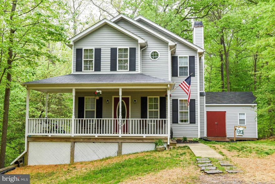 Less than  a mile inside the Ranch Club, sits this home on the end of the street overlooking nothing but forest. Large FR with fireplace, kitchen/dining with new tile flooring. All new carpet throughout home.  Nice size bedrooms.  Master with vaulted ceilings.  Fully finished walkout basement with den and rec room. Front porch for relaxing. Huge 12x24 workshop/shed with electric and heat. New HVAC