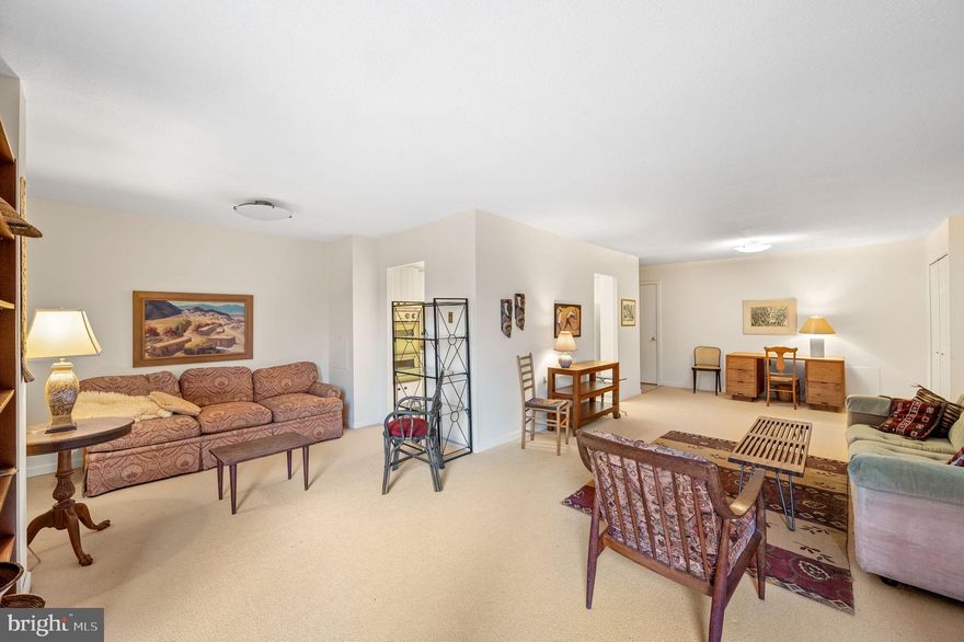 Welcome to Unit #818 at the Strath Haven Condominium, a spacious two-bedroom, two full bath condo. This corner apartment faces South and West with a large inset balcony facing Yale Avenue that provides a bonus outdoor space with privacy. While typical two bedroom apartments in the building are 1,050 square feet, this end unit is a more ample 1,210 square feet. The unit is laid out with a large living room and a separate dining room area, offering access to the balcony through a glass sliding door. The kitchen has the original cabinets and appliances from the late 60’s in very good condition! The kitchen is larger than the usual kitchens in the two-bedroom units and it has room for a breakfast table and chairs. The primary bedroom faces south and it is filled with natural light.  It has a beautiful view of the stately copper beech tree and the community gardens beyond. This bedroom has an en suite bathroom with a stall shower and generous closet space. The second bedroom has plenty of closet space and a full bathroom across the hall. The apartment has a handy laundry closet with a washer and dryer. A second large closet can double as a coat closet and a pantry. Unit #818 includes a very desirable carport, #8, located in the parking lot on the Yale Avenue side of the building. Carports are highly sought-after, and while they can be sold privately between community owners, they rarely change hands. The Strath Haven Condominium is recognized as a Gold Star Community by the Community Associations Institute. It is conveniently located near the town center of Swarthmore with easy access to Swarthmore College, the Scott Arboretum, shops, and the regional train station. The monthly condo fee is the most comprehensive in the area and includes electricity, gas, water, sewer, heating, and air conditioning. The grounds maintenance, building maintenance, outdoor pool, library, meeting room, hobby workshop, and a van for convenient shopping are included in the monthly fee as well. The only additional expense is cable/internet. These corner units are very desirable!