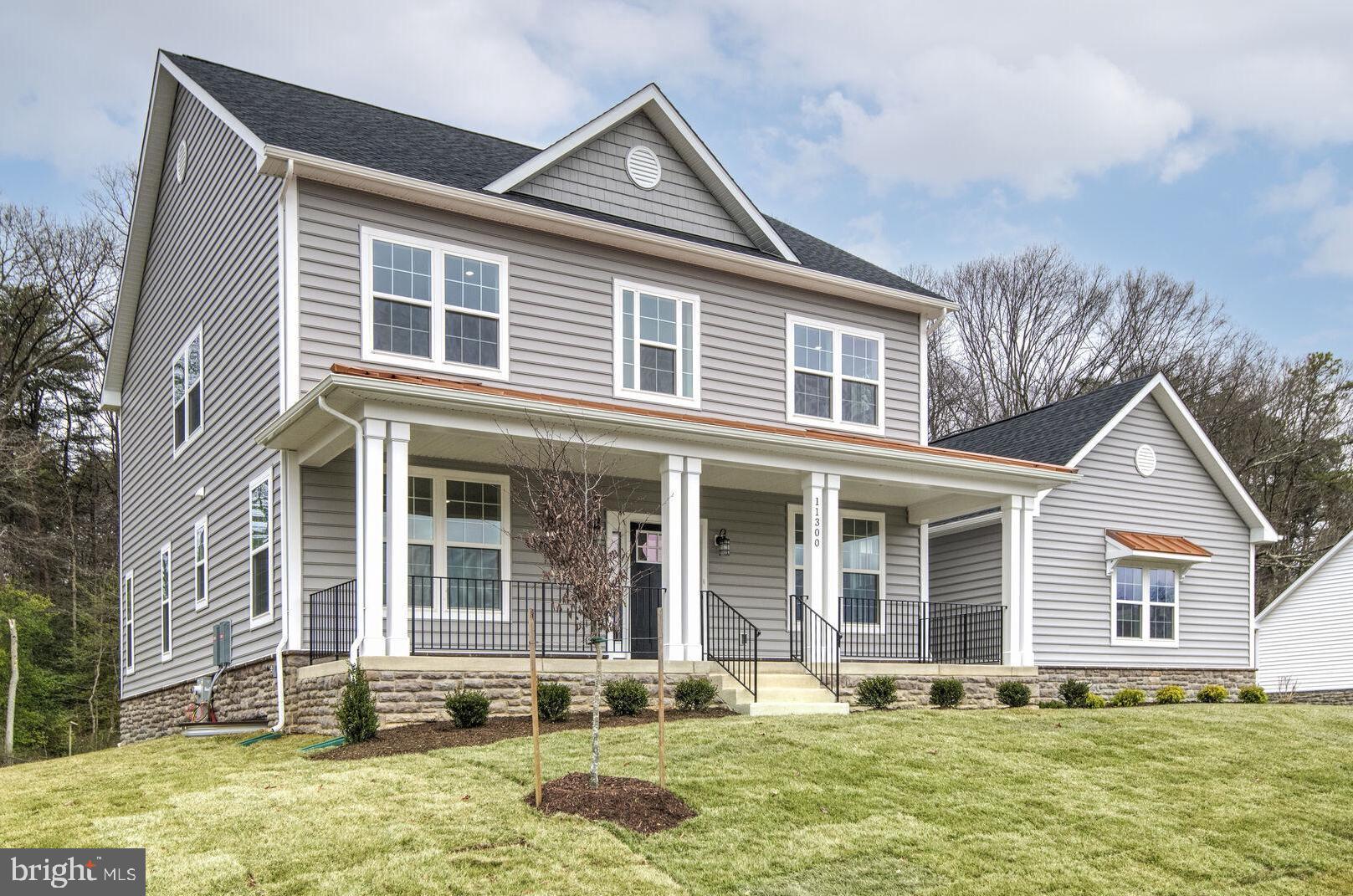 **Ready for Quick Move-in!** Gorgeous newly-built Potomac Model craftsman-style home in the bucolic Retreat at Glenn Dale community, by acclaimed builder Ness-Twigg. Situated on a 1/2 acre lot on a quiet culdesac surrounded by mature trees, this community with NO HOA is ideally-located just minutes from DC, Annapolis, and Ft Meade but with the peaceful serenity of sought-after Glenn Dale. Discover luxurious finishes throughout this 4-bed, 2.5-bath single family home with over 4300 sq ft and a 3-car garage. Luxurious details include 9-ft plus ceilings throughout, craftsman-style window casings, and Kohler plumbing fixtures. Main level boasts open-layout with wide-plank BJELIN Woodura Hardened Wood floors – Scandinavian-designed and ethically-sourced wood floors that are 3X stronger and nearly water-proof as compared to traditional wood floors. The luxurious family room with sleek electric fireplace and gourmet kitchen are the focal point of this home, offering quartz countertop, high-end stainless steel Bosch appliances including French-door refrigerator, Kohler designer faucet, customized cabinets, recessed lighting, large island with pendant lighting, subway tile backsplash and walk-in pantry. A formal dining room, living room, powder room, mud room with built-in storage cubbies complete the main level. When ready to unwind, head upstairs to the spacious Owner's Suite with tray ceilings, walk-in closet and en-suite bath with tub, standing shower with Schluter®-Kerdi waterproofing system, black Kohler fixtures , ceramic tile floors, and dual-sink vanity. Three additional light-filled bedrooms, full bath with tub/shower combo, plus laundry room located on this upper level. The versatile lower level with areaway for walk-up access to rear yard can be designed to meet your needs, including a potential bedroom and additional full bath, large rec room, and/or multiple storage rooms/dens. Energy-efficient and top-of-the-line features, including lifetime Tamko® Titan XT Premium Architectural Roof, high-efficiency Carrier HVAC, "maintenance-free" low-E argon windows and Variform® siding, Energy Star water heaters, oversized 400-amp electrical service, Masonite® Winslow insulated fiberglass front door, Aprilaire humidifier, R49/R21 insulation package, and Barricade® Wrap Plus™ Ultimate protection against wind and moisture. Level 2 electric car charger included! Relax on the composite rear deck overlooking a landscaped backyard with tree-lined views, perfect for outdoor enjoyment! All buyers receive 10-year RWC 2/10 home warranty for added peace-of-mind.