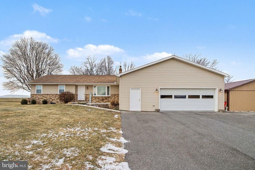 Welcome home to this well-kept ranch offering easy one-level living with 3 bedrooms and 2 full baths, including a primary bedroom with its own private bath. This move-in-ready home shows pride of ownership throughout, with each upgrade carefully planned and beautifully executed. The newly renovated kitchen features an open floor plan that flows into the main living space, making it great for everyday living and entertaining. Enjoy mountain views and step out onto the back deck overlooking open farm fields—perfect for relaxing or hosting guests. An attached two-car garage, detached pole barn, and shed offer plenty of storage and workspace, while solar panels add energy efficiency and savings. This home is ready for its next owner.