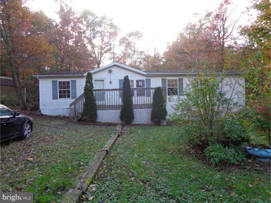 Are you looking for seclusion and privacy?  Here it is!!  Beautiful lot in Schuylkill County.  Off the beaten path but close to major highways.  Double wide with 3 bedrooms and a great view.  Property is sold "as is".  No sellers disclosure.  All municipal inspections and certifications are buyer's responsibility.