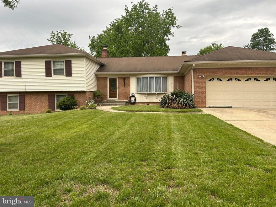 Location, location, location! PRICE IMPROVEMENT. Captivating, expansive home in the highly sought after subdivision of Enterprise Estates in Bowie, MD. This well kept home is a four level -split that has 5 bedrooms, 2 full baths, 2 half baths that sits on a large lot backed by serene and private tree line. The main level consist of a foyer, living room with a bay window, separate and formal dining room, updated gourmet kitchen with 2 sinks, stainless steel appliances, great room with fireplace, powder room and laundry room. The upper level has 4 spacious bedrooms with ceiling fans, and 2 full baths. The basement has a recreation room with a fireplace,  bedroom/office, and half bath. The lower level -spacious basement is unfinished, ready for your creativity and customization. New sump pump-2025, New 50 gal. HW heater-2025. There is also a huge deck and patio. Enterprise Subdivision is located on Rt. 193, minutes from Enterprise Golf course, Woodmore Towne center w/ Wegman's, and Costco. Prince Georges Hospital, Rt. 295, and I-495/95 are close. Property sold AS IS. No sign on property. Home warrany ($680). Please contact agent for showing.  Owner works from home and needs advance notification. Small dog in home.