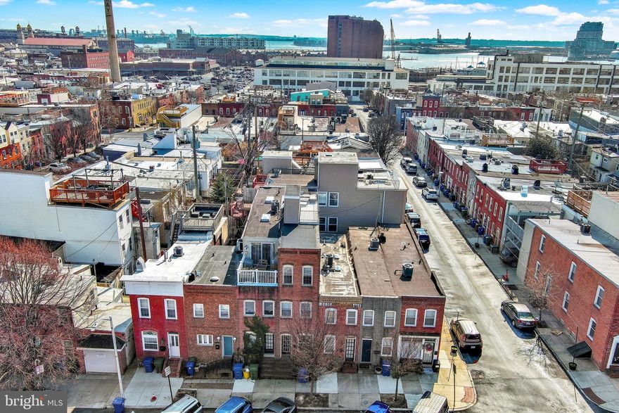 Beautifully maintained 3-bedroom, 2-full-bath home in the heart of Canton, just steps from restaurants, shops, and the waterfront. Featuring three levels of living space, this home offers a spacious layout with modern updates throughout, The rooftop deck, perched high, captures a limited water view and the excitement of the city below & is perfect for entertaining or simply relaxing while capturing the views!  Bright & sunny eat in kitchen with abundance of cabinetry, granite countertop and s/s appliances, Primary bedroom suite with full bath ensuite, Mid-level offers two generous bedrooms, hall bath and upper-level washer and dryer for added convenience. Experience true city living in one of Baltimore’s most sought-after neighborhoods!