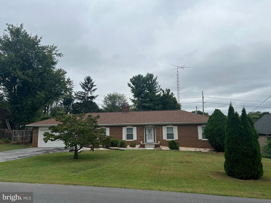 STOP THE SEARCH!!  THEY SAY PRICE AND LOCATION IN REAL ESTATE IS EVERYTHING ! THIS ALL BRICK RANCHER CHECKS BOTH OF THOSE BOXES AND MORE!!!
Tucked in the sought-after Briarwood Subdivision, 905 Hillcrest Dr gives you location AND lifestyle. Minutes to I-81, WVU Medical Center, War Memorial Park, shopping, dining, and entertainment. Quick trips to Hagerstown or Winchester? Easy. 
Weekend adventures in the Shenandoah Valley or Hershey Park? Even easier.
Inside, the main level serves up 3 bedrooms, 2 full baths, plus a bonus flex room off the kitchen - office, playroom, craft cave, guest space... you pick! The open dining + family room  w/ brick wood burning fireplaces make entertaining effortless, and the big deck out back is perfect for BBQs and starry summer nights.
But wait!!! There's MORE - the fun continues downstairs! The full, walkout basement comes loaded with a wet bar, wood stove, room for a pool table,  extra bedroom space, laundry room, and storage galore. 
Add in a 2-car garage and a backyard worth bragging about and you’ve officially found “the one.”
📍 Great location. 💰 Great price. ❤️ Great vibes.
Make 905 Hillcrest Dr your next chapter!