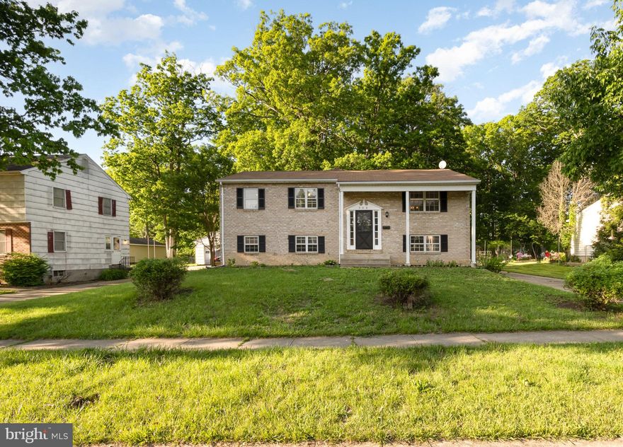 Welcome to this inviting split foyer residence nestled within the coveted Woodbridge Valley neighborhood in the community of Catonsville. Positioned on nearly half an acre and backs to trees, this home boasts a spacious layout flooded with natural light and privacy.

Walk into the house and notice the convenient foyer with a coat closet, letting you kick off your shoes and coat while keeping them neat and out of view. Walk up a few stairs to the main level to find hardwood floors throughout.  The generously sized living room has a large window, allowing plenty of light to come in. It flows seamlessly into the dining room, where sliding glass doors open to the deck and wooded backyard. The spacious kitchen boasts generous counter space and lots of cabinets, a pantry, and a large refrigerator. There is an additional sliding glass door to the deck, which allows a lot of natural light and easy access to the deck when grilling.  

Follow the gleaming hardwood floors down the hall, and you’ll find the hall bath, three bedrooms, and a linen closet. The primary bedroom is at the back of the house to ensure privacy. It is complete with large, deep closets and an ensuite bathroom featuring a stand-up shower.

The lower level is home to a versatile family room, an office space ideal for remote work or study (or a fifth bedroom), a sizable fourth bedroom (or whatever you'd want to do with it) with an ensuite bathroom, laundry, storage, and mechanical areas.

Step outside to discover the vast, level backyard, perfect for outdoor gatherings and relaxation. It is enhanced by an expansive deck overlooking lush greenery and your future vibrant gardens. At the end of the long driveway, the detached two-car garage with an electric door opener adds additional storage and makes parking and keeping your car out of the elements during bad weather easy and convenient. 

This home is  close to entertainment, shopping, and dining with Lurman Woodland Theater, Benjamin Banneker Historical Park & Museum, and Merriweather Post Pavilion, all nearby. The neighborhood is home to the Woodbridge Valley Pool, a private pool located conveniently down the street. The Catonsville area is in close proximity to major commuter routes, including I-695, US-40, and I-95. 
Residing here is so convenient to Catonsville Main Street, Security Mall, UMBC, BCCC. Old Ellicott City, nearby Rockburn, Patapsco Valley State Parks and Cascade Falls outdoors.

Schedule your appointment to see this home today. Offers due by 9am Monday 5/20.