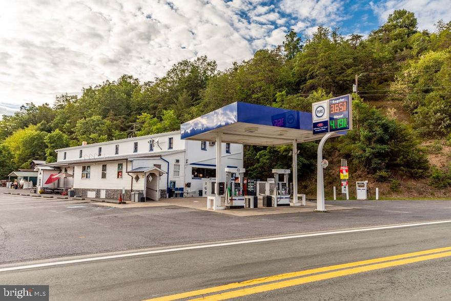 LOCAL LANDMARK FOR OVER 40 YEARS.  Misty Valley Grocery and Hardware in Mathias, WV is being offered for sale.  This convenience store and gas station is popular for locals, those vacationing at nearby Lost River State Park, weekend home owners enjoying the Lost River Valley and those driving by on busy Route 259.   Location, visibility, and ease of access make this a prime commercial property.   A successful hardware store co-operated at this location for over 40 years.  New owner could quickly reopen a hardware or home goods store which includes a separate entrance and loading dock.   2 BR apartment upstairs and full basement with drive in entrance downstairs.  The property was built as a feedstore so its solid and the open floor plan will allow the owner to operate any variety of business including retail, art studio, saloon, bakery, outdoor sporting goods, climate-controlled storage units, etc.  If you are the owner and the boss, the only thing holding you back is our imagination, the sky is the limit on what you could operate at this prime location.   Convenience store is being offered as a turnkey sale and inventory may be purchased under a separate agreement.