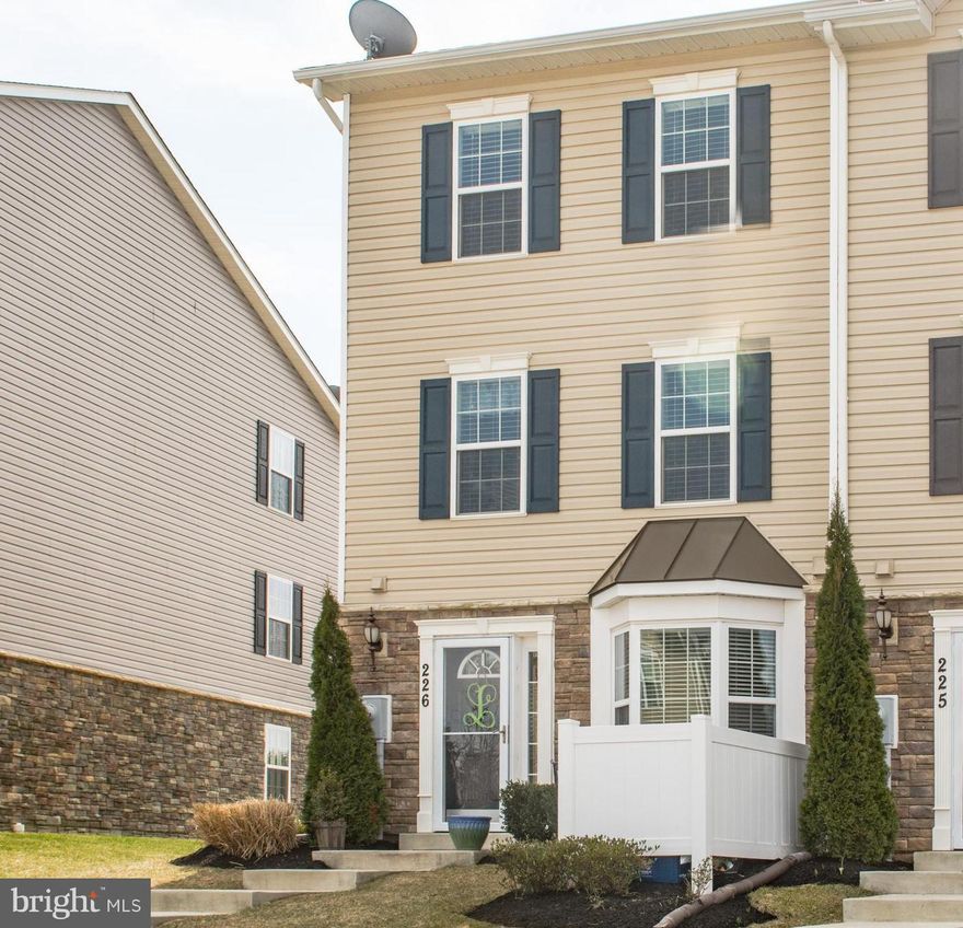 Rarely available end of group townhouse w/usable side yard and close proximity to tot-lot & pool.  The property features natural light throughout w/the end of group windows, granite in the kitchen, recessed lights, stainless steel appliances, tile in all the bathrooms, solid flooring in the family room and updated carpet.  The owners suite features a walk in closet & master bath with soaking tub!