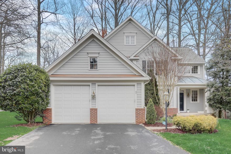 Prepare to fall in love with this stunning home in the highly desirable Wescott Woods community of North Reston. This 5BR, 3.5BA Ellis model is on a premium lot backing to trees and loaded with updates. The two-story foyer welcomes you and leads into the light filled living room with a picture window. There is a convenient main level library with bay window, a separate dining room, spacious kitchen that has white cabinets and granite countertops, tile backsplash, under cabinet lighting, center island with gas cooktop, SS appliances, pantry, built-in desk area, and breakfast room. The family room has a wood burning fireplace and French doors that lead to a Trex deck w/vinyl railing. Upstairs you will find 4 bedrooms and 2 full baths including a nice master suite with dual walk in closets and a spa like updated master bath bath retreat with standalone jetted soaking tub, two sinks, custom tile, fixtures, and vanity. Expansive walkout lower level offers 5th bedroom, 3rd full bath, large recreation room and incredible storage.  Near Wiehle Metro and the Reston Town Center. Approximately twenty minutes from Washington D.C., Reston boasts beautiful tree-lined streets with gorgeous manicured lawns, gardens, lakes and endless nature trails. Reston amenities include numerous swimming pools, tennis & pickleball courts, ball fields,  playgrounds.  You will not want to miss this fabulous home!