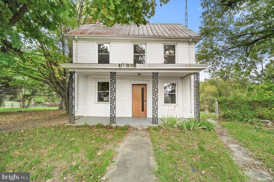 Welcome home to your farmhouse dream! This picturesque farmhouse features two bedrooms and one full bathroom and is situated on just over an acre and a quarter and includes the additional adjoining lot at 1.39 acres for a total of 2.9 acres that is sub dividable and buildable. Where rustic charm meets modern comfort this delightful home offers the perfect blend of country living and convenience. As you approach the property, you'll be captivated by the serene surroundings, including sprawling green fields and a sense of tranquility that only a farmhouse on almost 3 acres can provide. Step inside to discover a warm and inviting living room that exudes farmhouse charm. The hardwood floors and a fireplace create an ambiance that is both cozy and inviting. The kitchen boasts modern amenities while retaining its farmhouse character. It's equipped with all the essential appliances and offers plenty of counter and cabinet space, making meal preparation a joy. The two bedrooms are well-appointed and offer a serene retreat after a long day. Natural light pours in through the windows, adding to the overall charm. The vast almost 3-acre lot provides ample space for gardening, outdoor activities, or even the potential for expansion. Enjoy your morning coffee or relax in the evenings on the inviting covered porch, which offers a perfect vantage point to take in the scenic views of the property. This farmhouse is ideally situated for those seeking a peaceful rural lifestyle while remaining close to essential amenities.  Hagerstown is just a short drive away, offering grocery stores, schools, and dining options. Don't miss out on the opportunity to own this charming two-bedroom, one-bathroom farmhouse on 3 acres of serene countryside. Contact us today to schedule a viewing and make this your idyllic rural retreat!