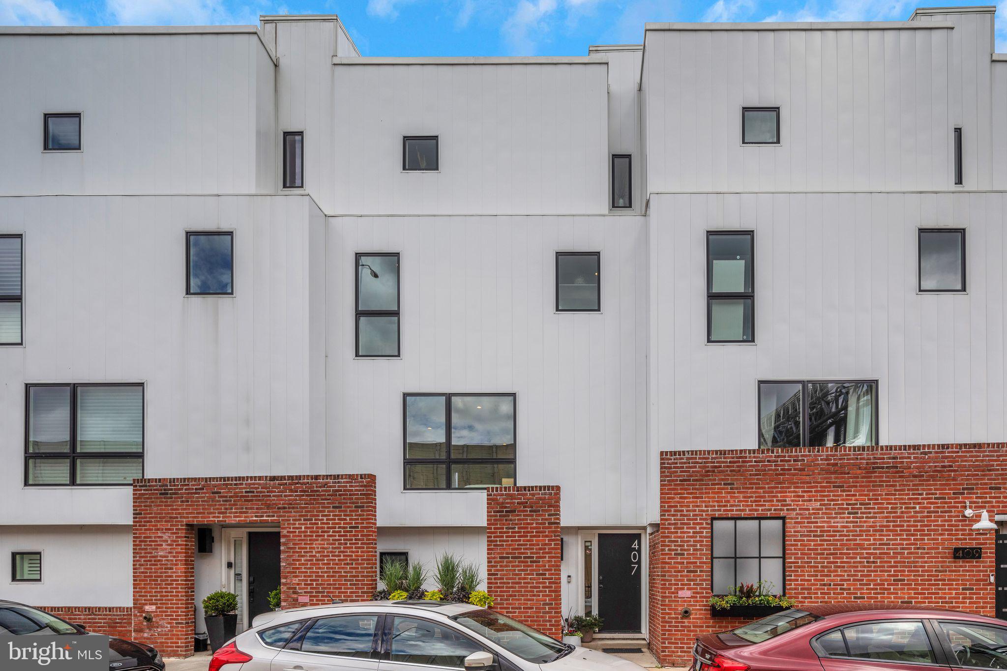 Welcome to 407 Salmon Street, A Distinctive Modern Home in the Heart of Fishtown. Located in Riverside 8, one of Fishtown’s premier new construction communities by acclaimed builder Red Oak Development, this exceptional 3 bedroom, 2 and a half bath home blends upscale finishes with thoughtful design across multiple levels of stylish urban living. This is not your typical cookie-cutter build—this is a semi-custom residence tailored for those who value space, light, and quality.
The floor plan offers over 2,700 square feet of contemporary living with 4 private outdoor spaces including two balcony terraces, a front patio, and a full rooftop deck with breathtaking views of the Philadelphia skyline, Ben Franklin Bridge, and Delaware River. Whether you're entertaining guests or enjoying a peaceful morning coffee, this home was designed to elevate your everyday experience.
Rare for the neighborhood, enjoy the convenience of an oversized 1-car garage—perfect for parking and extra storage. Inside, you'll find 20+ ft of width, giving the home a spacious, open feel that's hard to find in the city. The first living floor is on the 2nd level with an open floorplan, kitchen, dining area and living space. Custom cabinetry in the living room and kitchen, quartz counter tops and a half bath. The 3rd floor features 2 exceptionally spacious guest rooms, laundry room and full hall bath. The final level is the primary suite with spa style bath, glass enclosed shower, double vanity, oversized bedroom and a private terrace. The first floor features the entry foyer, garage and utility closets. The amount of storage space is overwhelming. Interior features include: wide-plank oak hardwood floors, expansive Pella windows for natural light, quartz countertops with a custom glass window backsplash, designer kitchen with stainless steel appliances and modern lighting.
Just steps from Girard Avenue and Frankford Avenue, you’re in the epicenter of Philadelphia’s trendiest neighborhood. Enjoy walkable access to Penn Treaty Park’s riverfront trails and top-tier dining. Plus, you're just minutes from the Market/Frankford Line and I-95—perfect for commuters to Center City, NJ, or NYC. Approximately 7 years left on the full 10 year abatement. 407 Salmon Street is more than a home—it’s a lifestyle. Schedule your private showing today and step into modern Fishtown living at its finest.