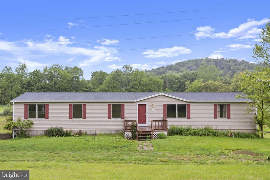 Remodeled home on 5 acres with mountain views! 2128 square feet of living space on the main level with large living room and family room with vaulted ceiling. Spacious kitchen with lots of cabinet and counter space for preparing meals and open to the dedicated dining area. The owner's suite offers privacy with full bath including a soaking tub and walk-in shower. There are 2 additional bedrooms on the opposite side of the house that share a full bath. Additonal living space is in the basement with full kitchen, living area, bedroom, full bath, laundry hookup and additional room for office. The double garage is also located in the basement. There is a back deck showing the mountain views. Convenient to the Towns of Broadway and Timberville with restaurants, shops, grocery stores, Walgreens, Walmart and the North Fork of the Shenandoah River. Property sold as is, where is.