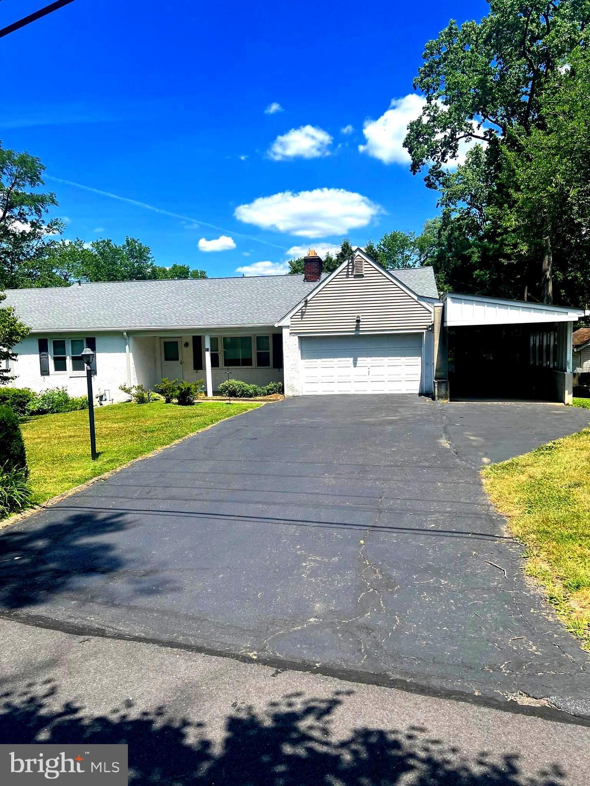 Nestled on a corner lot in the Pine Tree Farms section sits this spacious 5 bedroom 2 full and 2 half bath Rancher in Neshaminy School district.  Come home and relax in the formal living room with a stone fireplace, built-ins for your favorite books and collectibles. The formal dining room offers space for entertaining and easy access to the eat-in kitchen with electric smooth top stove and pantry.  Access to the Sunroom from the kitchen making traffic flow a breeze for every day living or special occasions!   The powder room is conveniently situated next to the garage and the Sunroom.  Interior door entry to the 1.5 car garage which has unfloored storage above.  If you need space this is the place! The rear addition added 2 extra bedrooms, a full hall bath and additional space in the basement.  Main front bedroom with a sweet full bath consisting of a tub and shower combination , vaulted ceiling,  skylight,  vanity, sink and a linen closet.  There is 4 additional good size bedrooms on the main level all offering nice size closets for storage. The second full hall bath is also a tub and shower combination, vanity, sink and a over size linen closet in the hall. Wait for it, even more space to spread out and be creative. The partially finished full basement has been divided up into  a large room (33.9x28.10), let's call that the recreation room with a wood burning stove, a walkout to the rear of the house and a half bath. Next is a (13.10x6.2) storage room, the (8.11x12.2) laundry room that was part of the addition, a second exterior door in the (12.9x6.7 ) storage room which is also part of the addition along with a (17.4x12.8 ) storage room, a heater room (8.2x9.3), the original laundry room (16x14.4 ) with a storage closet and that is where you will find the electric panel. Endless possibilities to create your own space in each room.  The measurements of all the rooms in the house is approximated including the basement.  Additional parking , carport and the extended driveway. Extra remarks, Whole House fan, 3 zoned heat, newer 40 gallon gas hot water heater installed November 2022, gas boiler heater installed November 2018, roof installed in July 2015.   The seller will not make any repairs and the home is being sold as is.  So much space for the money! P.S there is a fenced area to keep the pets safe. A in-ground pool in the rear yard was removed and filled in.
