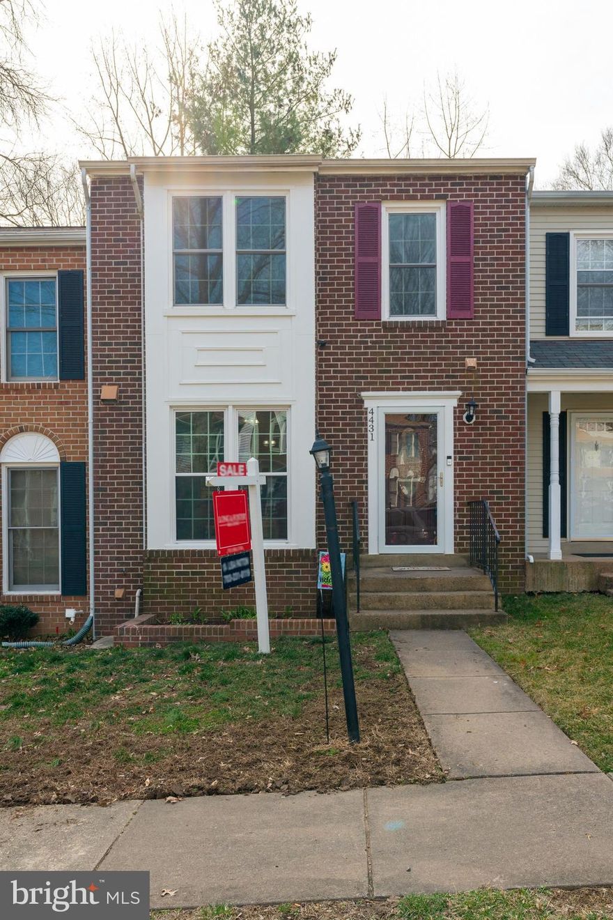 Great curb appeal in this brick front three level town home with 3 bedrooms and 3 1/2 baths.  So many updates. Professional pictures coming soon!Freshly painted and ready for a new owner...roof replaced in 2010, HVAC 2012, the hot water heater and windows were replaced in 2017 as were the sliding doors and front door. Siding was replaced in 2018. Wide plank hardwood floors on main and upper floor installed in 2018 and remodeled hall bath in 2019. This lovely town home has a real separate dining room and step down to spacious living room. There is a fully tiled powder room and the hand scraped hardwood floors are throughout the top two levels. The kitchen has a large sunny window and plenty of space for a table. Granite counter-tops, a tiled back-splash, stainless steel appliances, a wood look porcelain tiled floor and a pantry. There is also a granite overhang for barstools. The living room has a cozy wood burning fireplace with mosaic tiled surround. New steps lead out to fenced back yard that backs to a heavily wooded area so lot of privacy. The basement has a family room space and bedroom (NTC), as it has a small window and closet.  Located at the back of the community, away from the noisy streets.