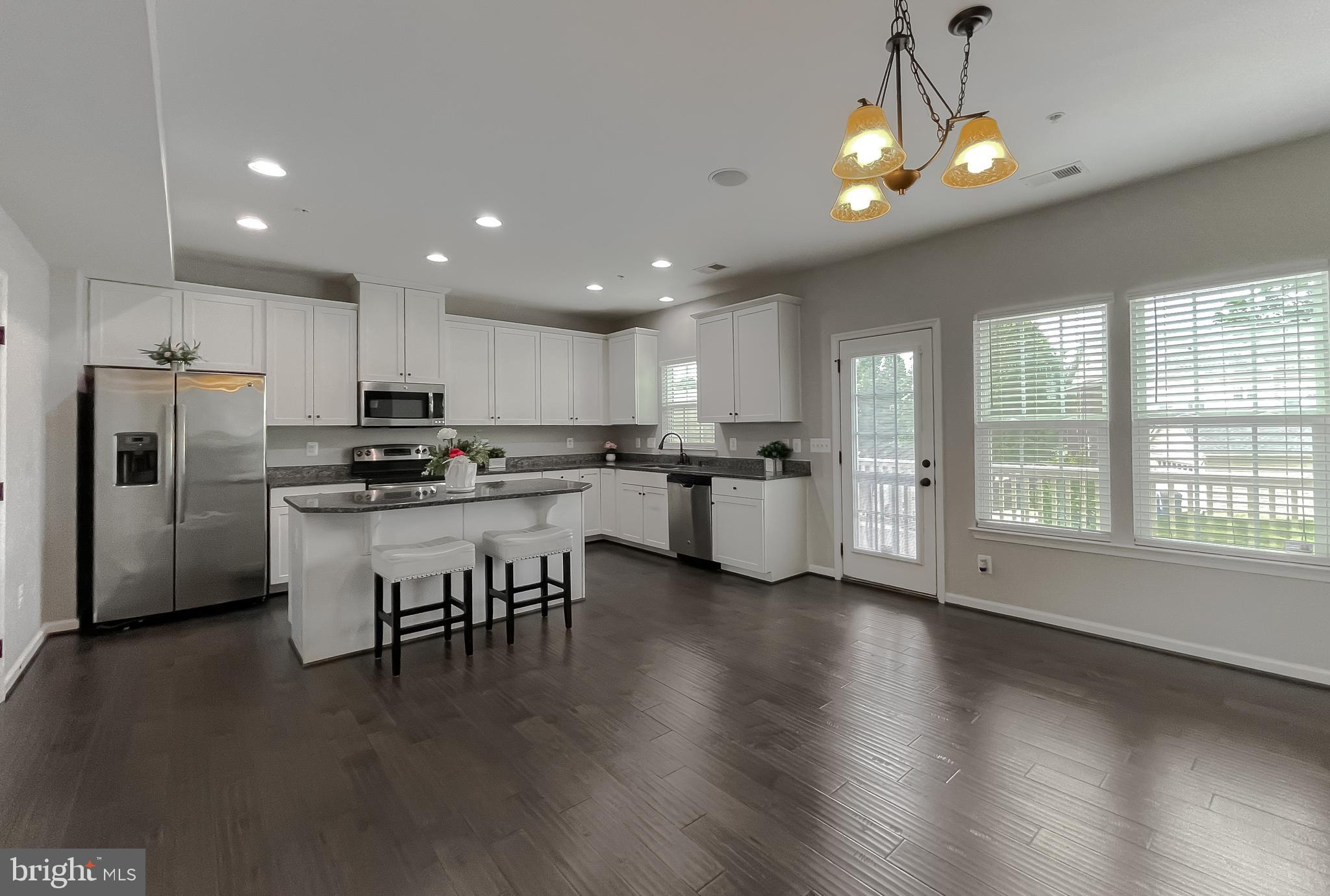 This former model is stacked with upgrades and serious style. The garage? Used to be the sales office, so you know it got the VIP treatment. Inside, the entry level features a rec room perfect for chilling or entertaining. Up one floor, you’ll find hardwood floors, a spacious living area, and a kitchen that’s showing off with granite countertops, stainless steel appliances, a center island, and 42” cabinets. Plus, there’s a deck for your sunshine and sangria moments. Upstairs, it’s all about convenience and comfort: 3 bedrooms, 2 baths, and laundry right where it belongs. The owner’s suite brings the wow factor with tray ceilings and a luxe super bath finished in stunning ceramic tile. Bonus points for the built-in sound system and Ryan Homes’ BuiltSmart energy efficiency. Stylish, smart, and move-in ready! 650 minimum credit score required and income must be equal to or more than 2.5x the monthly rent amount.