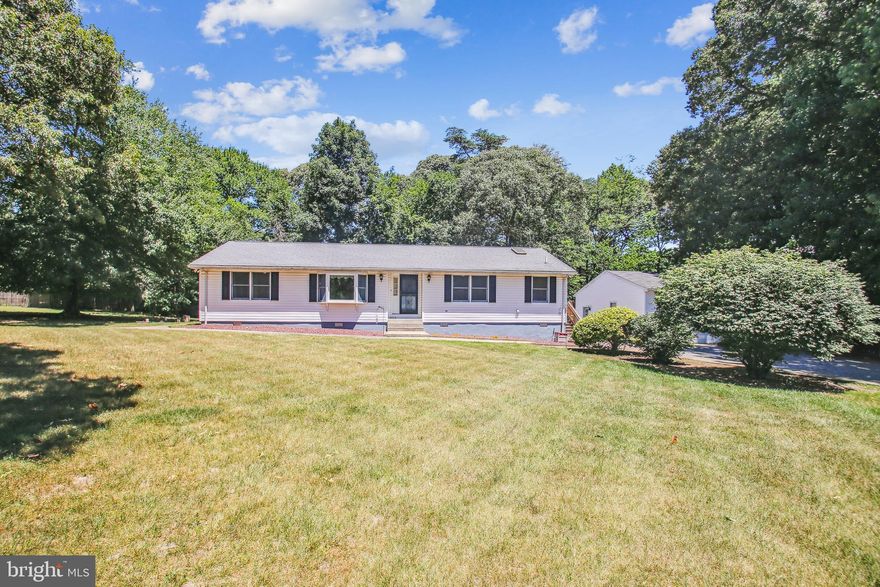 One level living in Severna Park! Peaceful, park-like environment yet close to everything! Meticulously maintained 3-bedroom, 2-bath ranch home located on a quiet dead-end street.  Stunningly updated and freshly painted throughout, this home features a light-filled, open floor plan with new luxury vinyl plank flooring (2023) in the living, dining, kitchen, and hallway.  The newly renovated kitchen (2023) has been thoughtfully designed and includes beautiful quartz countertops and new stainless appliances (2023).  Windows abound in the warm and inviting family or sunroom with newer carpet, a brand-new barn-style door for extra privacy when needed, and a split-system HVAC for added comfort all year long.  Enjoy morning coffee or a quiet evening on the outdoor deck just off the sunroom.  The spacious primary suite boasts newer carpet (2022), two walk-in closets, a meticulously renovated primary bath (2023) with LVP flooring, double vanity, and a beautifully tiled spa-like shower.  Two additional bedrooms, one featuring newer carpet (2022), along with a full bathroom and laundry room, complete the home.  The detached, oversized 2-car garage offers ample space for cars, workshop, or the hobby enthusiast!  This home sits on a nearly 3/4 acre, partially fenced, flat lot, providing plenty of space for all your outdoor activities, and includes a large, outdoor shed with a dedicated space for your riding mower!  Enjoy the serenity of living in a rural setting while being just minutes from shopping, schools, restaurants, and major commuter routes to Annapolis, Baltimore, DC and Columbia.  Schedule your tour today!  Welcome Home!