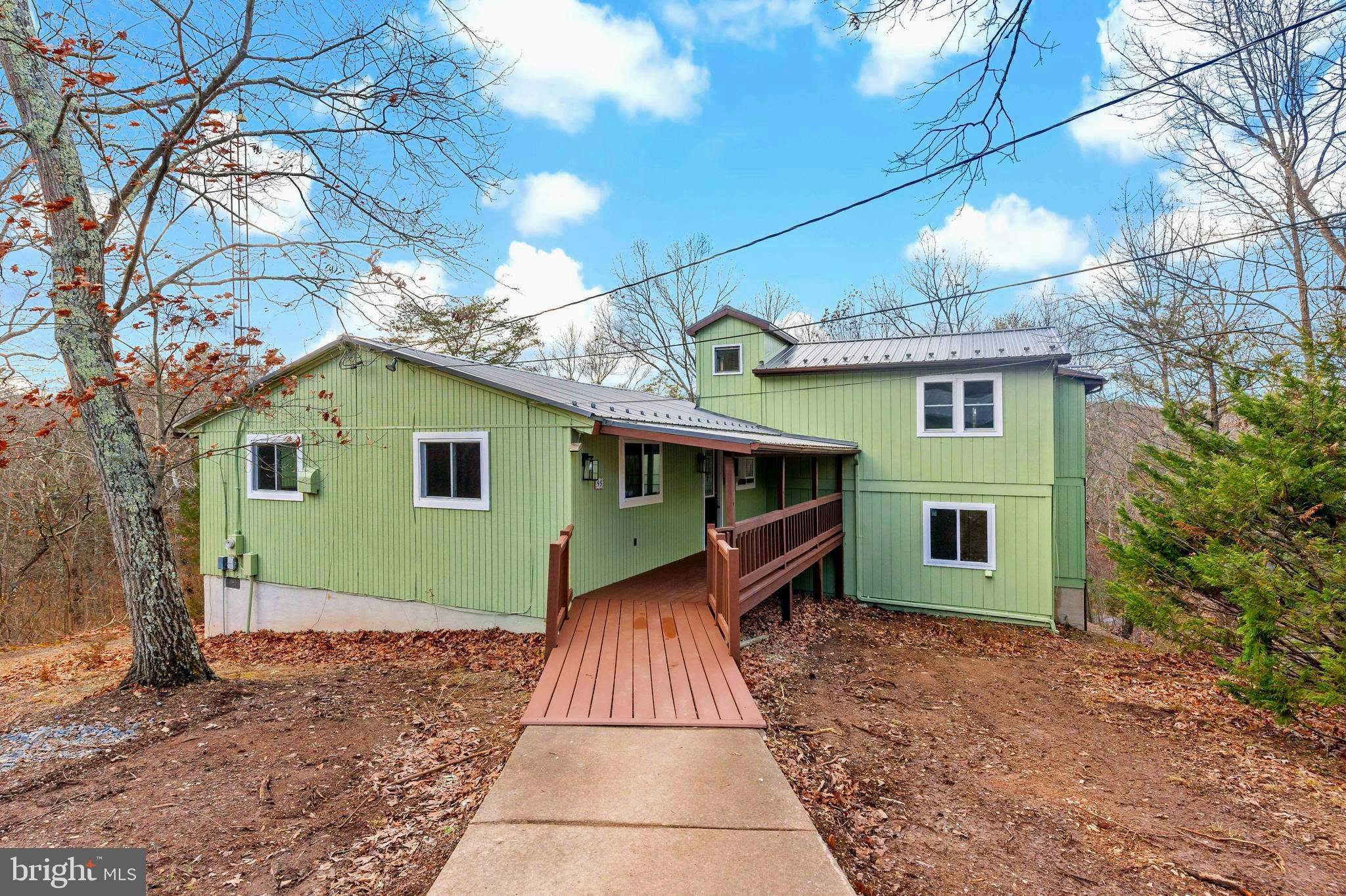 Discover the serene beauty of this 4.61-acre property that offers both privacy and endless possibilities. If you've been searching for a tranquil retreat, this could be the perfect opportunity to create your dream home! The main residence boasts 3 bedrooms and 2 bathrooms, providing comfortable living space for you and your loved ones. In addition to the main house, there's a detached garage with ample space for two vehicles and additional storage. Whether you're a car enthusiast or need a workshop space, this garage has you covered. Recently rehab with new windows, paint, and flooring, this home is ready for a new owner.