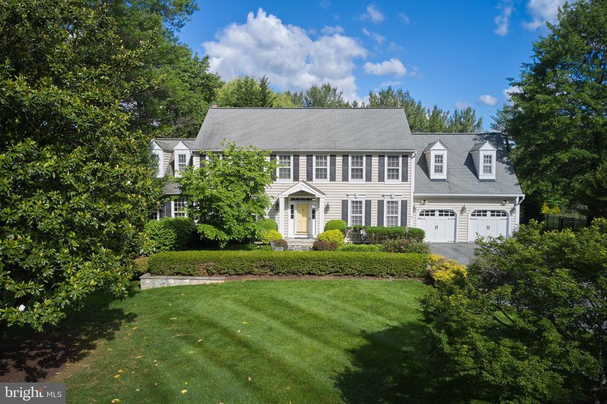 OPEN TONIGHT! JUNE 13th  from 5-7pm - SEIZE THE OPPORTUNITY TO SEE THIS EXQUISITE HOME!Welcome to a residence where timeless elegance meets modern luxury.  Thoughtfully designed and meticulously maintained, this exceptional 4/5-bedroom, 3.5-bath Colonial is sited on a beautifully manicured and deceptively expansive 1.14 acre estate – extending gracefully behind neighboring homes to provide space for extensive gardens or additional. area for play.  From the moment you arrive, a stately flagstone courtyard bordered by a handcrafted stone wall and inviting front porch crowned with a wooden barrel ceiling, sets the tone for what’s to follow.  Step inside the center hall foyer, where detailed moldings and rich hardwood flooring that extends throughout the entire main level, welcomes friends and guests alike.  Elegant formal living and dining rooms flank the entry and lend a level of sophistication to entertaining and intimate gatherings.  At the heart of the home, the stunning kitchen will delight the most discerning chef.  Outfitted with a Wolf six-burner gas cooktop and Kitchen Aid appliances including two convection ovens, convection microwave and a panel-front built-in refrigerator – this space is as functional as it is inspiring.  A Miele dishwasher, extensive off-white cabinetry, gleaming granite countertops, a massive 7’ x 4.5’ island with breakfast bar adjacent to an ample table area with access to the deck, complete this extraordinary space.  Flowing seamlessly from the kitchen, the sunlit family room features custom built-ins, a striking stone fireplace and a wall of windows offering serene views of the expansive 58-foot deck and scenic grounds. A chic home office or den adorned in navy-blue grass cloth and offering direct access to the deck, provides a tranquil retreat for remote work or reflection. The thoughtfully designed mudroom with built-in bench with coat hooks connects to the two-car garage and includes a full laundry area and private stairway to an en-suite bedroom –perfect for guests or multi-generational living. On the opposite wing, the luxurious primary suite is a sanctuary unto itself.  Featuring a spa-inspired bath with soaking tub, walk-in shower, dual marble-topped vanity, and adjacent custom closet (originally a fifth bedroom which could be converted if needed). This suite also includes two additional closets and a private sitting room or office.  Two additional spacious bedrooms and a beautifully renovated hall bath complete the upper level.  The finished lower level with paneled wainscoting and recessed lighting offers versatility and leisure, including a game area (pool table conveys), spacious seating area, exercise room, and two large storage rooms –plus rough-in plumbing for a full bath.  Outdoors, a spectacular fenced backyard and the 1,100+ square foot deck provide the perfect setting for sophisticated alfresco entertaining, from intimate dinners to grand celebrations.  The home is ideally situated near shopping and the premier South Germantown Recreation Park and Maryland Soccerplex, with effortless access to I-270 and Potomac’s scenic back roads for commuting ease.  This is more than just a home—it is a lifestyle.  Discover the rare opportunity to own a property of this caliber, where every detail has been created for comfort, elegance and enduring value.  
DON'T MISS THE WALK-THRU VIDEO!