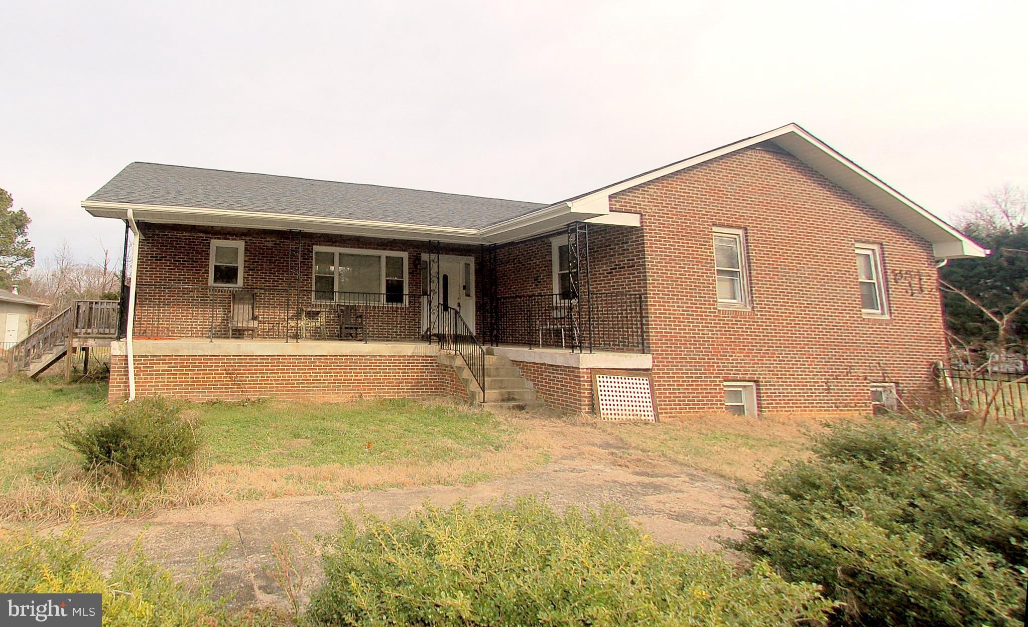 Huge 4BR 2BA brick rancher with full unfinished basement. Home needs renovation with some work started including a new roof, kitchen, HVAC, HWH, rear deck and first floor flooring. Basement has stud partitions but needs drywall. Previous drywall removed after a flood from a faulty sump pump.
Property has a large lot and oversized garage, perfect for a home business. The lot is 2.71 acres of mostly fenced lawn. Garage is divided into three parts. - 1) A church with pulpit, choir seating and eight rows of pews, 2) large workshop with double car size doors and tall ceilings, and 3) single long garage with extra storage. The garage has water, electric, oil furnace and central air conditioning. Garage roof needs to be replaced and is leaking in several spots.