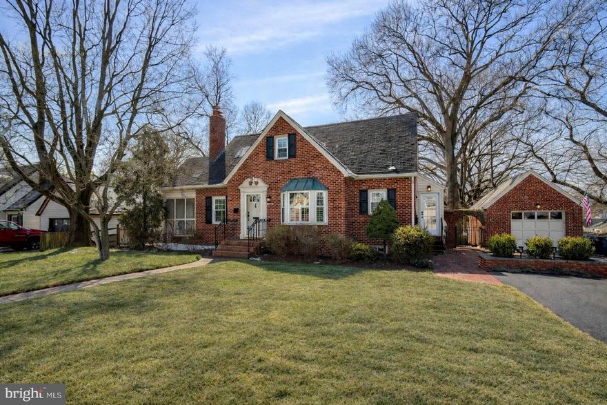 Welcome to this beautifully updated brick Colonial in sought-after Courtland Park, Falls Church, set on a spacious, flat lot just under half an acre! With timeless architecture and thoughtful renovations throughout, this home seamlessly blends classic charm with modern functionality and luxury.

The main level is anchored by a generously sized primary suite, offering convenience and privacy rarely found in traditional Colonial layouts. Entertain with ease in the dining room, where a bright bay window fills the space with natural light. The renovated kitchen is both stylish and highly functional, featuring a gas range, soapstone countertops, a breakfast bar, and abundant cabinetry to keep everything organized and within reach. Just off the living room, a screened-in porch provides the perfect setting for morning coffee or relaxed evenings overlooking the surroundings.  Everyday living is made simple with a side-entry mudroom connecting directly to the driveway—ideal for unloading groceries or managing busy schedules. To top things off - a main-level half bath adorned with statement wallpaper adds personality and flair, sure to leave a lasting impression on guests!

Upstairs, three full bedrooms share a newly updated full bathroom, offering flexibility for bedrooms, a home office, nursery, or creative space.

The fully refinished lower level expands your living options even further. Designed with versatility in mind, the basement includes a spacious second living area, an additional bathroom, and a flex room perfect for a guest suite, gym, or office. Extensive storage space ensures everything has its place, and the walkout access to the driveway adds both convenience and functionality.

Outside, the fully fenced backyard is built for enjoyment. A newly added spacious trex deck is strung with café lights creates an inviting atmosphere for entertaining, dining al fresco, or simply unwinding at the end of the day. Parking is equally accommodating, with a single-car garage and a double-wide driveway providing ample space for multiple vehicles and guests.

Ideally located just around the corner from Baileys Crossroads and major commuter routes, this Courtland Park gem offers both neighborhood charm and exceptional accessibility. Thoughtfully updated, generously sized, and designed for modern living, this is a home that truly checks every box!