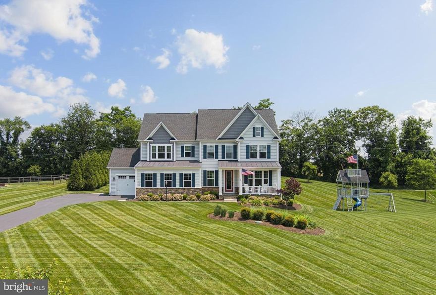 Welcome to 1020 Thunderbird Dr -  a beautifully appointed 4-bedroom, 3.5-bath luxury home in the sought-after Fairlane Farm community. Nestled on 1.25 acres and set back on a prime lot, this NV Homes Longwood Model offers the perfect blend of space, comfort, and elegance in a peaceful setting.  The main level features an open floor plan with hardwood floors throughout, a spacious family room with fireplace, and a gourmet kitchen equipped with a massive island, classic white cabinetry, tile backsplash, gas cooktop, double ovens, and new stainless steel refrigerator, dishwasher, and microwave. Additional highlights include a walk-in pantry, formal dining room with crown molding, private office with built-ins, a mudroom, and a stylish half bath.  Upstairs, the primary suite boasts a tray ceiling, two walk-in closets, and a spa-like bath with soaking tub, dual vanity, and a tiled walk-in shower. Bedrooms two and three have walk-in closets and share a convenient Jack-and-Jill bath, while the fourth bedroom includes a walk-in closet and private en suite bath. The oversized laundry room adds everyday ease.  The expansive lower level includes an unfinished basement with a designated play area, ready for storage and your finishing touches.  Step outside to enjoy the screened porch, deck, and a custom patio with firepit added in 2020—perfect for relaxing or entertaining. Additional features include a storage shed (2022), a 2-car garage plus a separate carriage garage ideal for a third vehicle or workshop, epoxy garage floors, a new water heater (2025), and a playground (2023).  Located in a vibrant community with top-rated schools and convenient access to major commuter routes, this exceptional home offers it all.  Schedule your tour today!