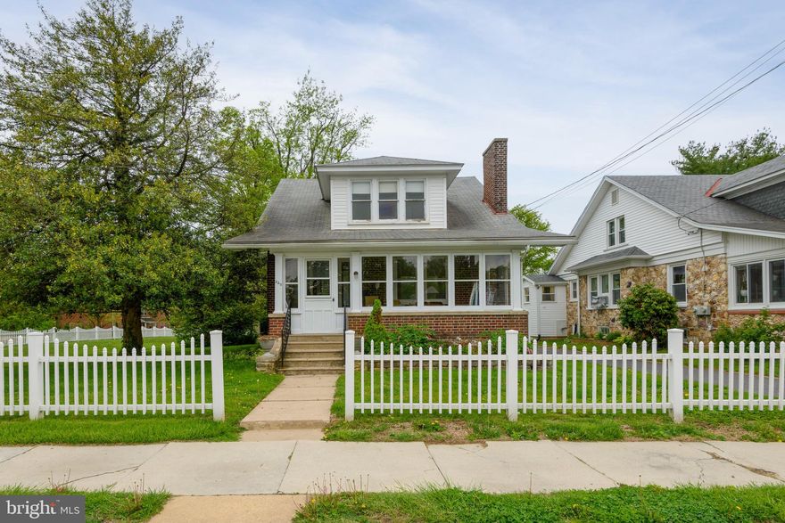 Welcome to 220 S. 5th Street, an adorable brick Cape Cod ideally located within walking distance to schools and the charm of downtown Oxford. This well-constructed home showcases true craftsmanship and timeless character, beginning with an inviting enclosed sun porch perfect for relaxing year round.

Step inside to a spacious living room filled with natural light and anchored by a classic brick fireplace with a gas log insert. The formal dining room features a beautiful triple window, creating a warm and inviting setting for gatherings.

The custom galley-style kitchen is both functional and stylish, offering rich cherry cabinetry, granite countertops, a deep stainless steel sink, glass-top electric range, built-in microwave, dishwasher, and a convenient coffee bar. Just off the kitchen, a rear entrance leads to a well-designed laundry/mudroom complete with built-in cabinetry.

The main level includes two comfortable bedrooms and a full bath, while the second floor offers an open staircase leading to a bright and airy loft area, two additional bedrooms, and a separate unheated storage room. Throughout the home, you’ll find beautiful hardwood floors and ample closet space.

Outside, enjoy a nicely fenced yard with generous side and rear lawn areas, enhanced by mature trees, attractive plantings, and thoughtful landscaping. A paved shared driveway leads to a detached two-car garage.

The clean, painted unfinished basement provides additional flexibility and includes a powder room and outside entrance. Comfort is ensured year-round with a dual-zone hot water cast iron radiator heating system.

A wonderful opportunity to own a charming, well-maintained home in a highly convenient Oxford location.