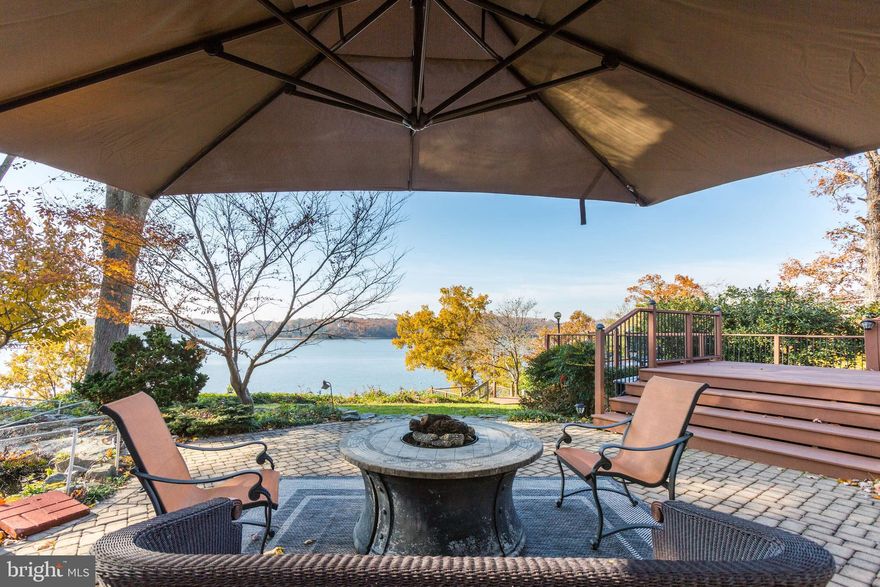 Beautiful Severn River Water Front home with amazing views & sunsets! Long & short term rental! Minutes from historic downtown Annapolis and the Naval Academy! Dead end street in a wonderful neighborhood this beautifully furnished and fully equipped 4BR/4FB almost 3,000 sq ft home with private beach & magnificent views of the Severn River. Large gourmet kitchen, living room with double sided, to dining area, fire place, glass enclosed sun porch, & large family room with pool table. Decks, patio and koi pond, Swim Spa, stairs & tram to pier.  Large, open floor plan on 4 levels. Relax in the living room with vaulted ceilings, gas fireplace, and large flat screen Smart TV with Amazon Firestick. Enjoy the well-equipped eat in kitchen with granite countertops, KEURIG coffee maker, wet bar and ice maker. Spend time relaxing in the glass enclosed sun porch with dining area, gas fireplace and sitting area overlooking the Severn. There is a large, lower level family room with TV, pool table, foosball table and a full bath. The master bedroom has a sitting area with gas fireplace, a private office and large bathroom with separate shower and jacuzzi tub. There are three additional bedrooms and 2 additional full baths on upper level. WIFI, central air, ceiling fans and extensive hardwood and plank flooring. Beautiful outdoor space with multi-level decks & a stone patio with Koi pond. 18  swim spa/hot tub is available (April - November) for an extra fee of $300 and a minimum 7 days advance notice. Outdoor kitchen with gas grill and outdoor shower (seasonal). Access the private beach via stairs or tram. 70' pier with water/electricity, boat lift (extra fee applies), 9-11 ft deep water and extensive views! Automatic generator and ample off-street parking. Linens included. PLEASE NOTE House is located on a steep hill with no fencing. Children must be supervised by an adult at all times due to the hill, pond, spa and tram. Easy commute/ day trips to the Eastern Shore, Baltimore and DC! : )