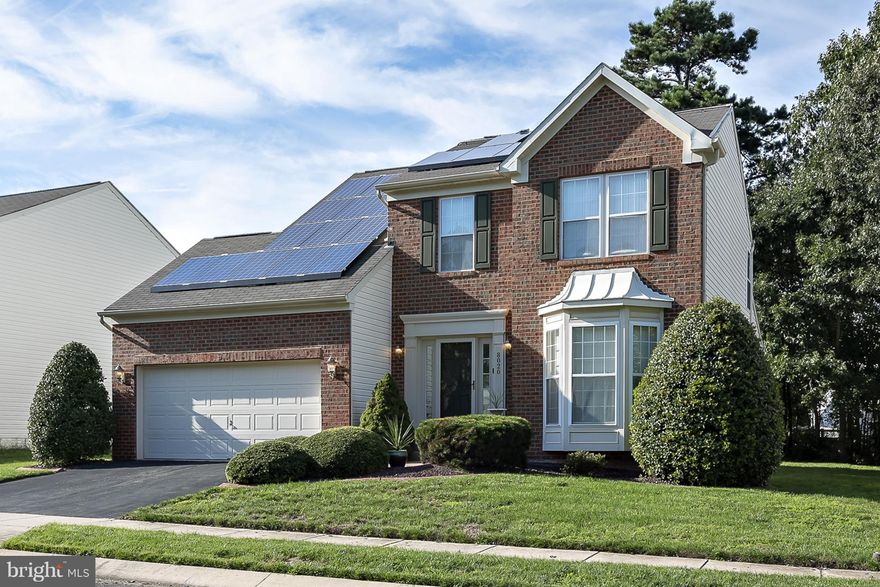 Stunning brick-front colonial w/2 car garage features many upgrades throughout! Updated KIT (granite counters, island, & SS Apps), Beautiful & bright morning room addition w/ vaulted ceilings leads to patio & yard backing to trees! Cozy Fam room off KIT w/ gas FP! Master BR has expansive walk-in closet! Finished basement has large rec room, full bath, & HUGE storage area! NEW Solar Panels in '14.