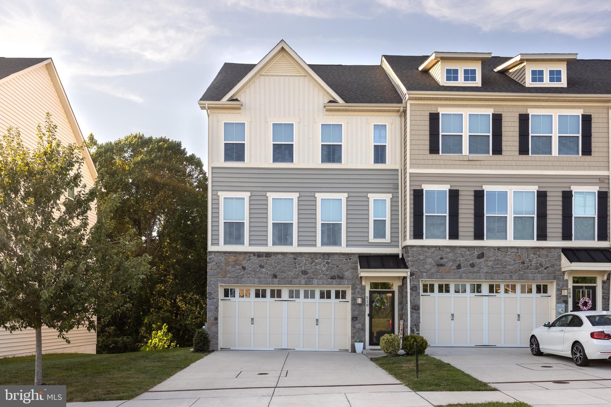Welcome to this beautifully maintained 3-bedroom, 3.1-bath end-of-group townhouse in Magness Mill community, built in 2017! The main level features luxury vinyl plank flooring, a spacious living room, and a stunning kitchen and dining area combo with a 12-foot island, granite countertops, stainless steel appliances, a pantry, and a cozy nook that’s perfect for a home office or coffee bar. Enjoy entertaining or relaxing on the maintenance-free 19x9 deck overlooking the private, tree-lined backyard. Upstairs, the primary suite offers a walk-in closet and a spa-like bath with dual sinks, a water closet, and a walk-in shower with double shower heads, while two additional bedrooms, a second full bath, and a convenient laundry room complete the level. The fully finished lower level provides even more living space, featuring a full bath and walkout access to a 30x13 paver patio with a retaining wall—ideal for outdoor gatherings. With a 2-car garage, updated finishes, and a premium lot that backs to trees, this home perfectly combines modern style and comfort in a peaceful setting, while keeping you close to shopping, dining, and major commuter routes!