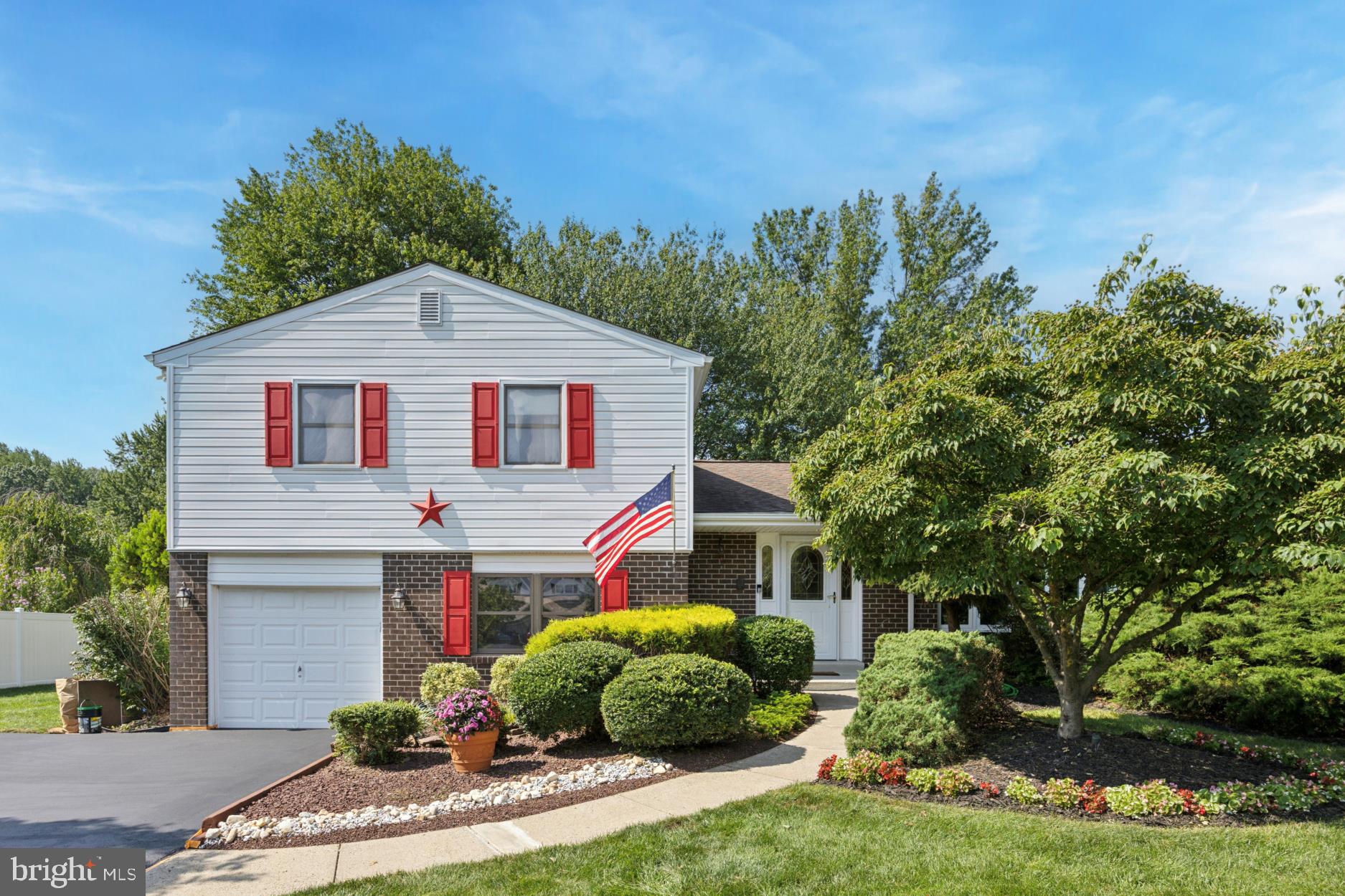 Don't miss this lovely home in the desirable neighborhood of Deerfield North and in the coveted school district of Council Rock. Enter into the spacious foyer with a double door coat closet, vaulted ceiling and tile floor. To the right there is a large living room with wood floors, crown molding and a beautiful, sunny bay window. The kitchen offers the best in meal preparation with stainless steel appliances, white cabinets, range hood, built-in microwave and tile floor. The large dining room is just adjacent to the kitchen. Perfect for gatherings it features a wood floor, crown molding and double door entry to the deck. Downstairs you will find a large family room with new floors, recessed lighting and a utility closet. Down the hall is an office that could be a 4th bedroom with a large closet and sunny windows. Upstairs are three more bedrooms. The Primary bedroom features a walk in closet plus single door closet, wood floors, ceiling fan and a primary bath with shower stall and upgraded sink and vanity. Two more bedrooms and a remodeled hall bath complete this level. The garage offers a parking space and storage. Newly sealed, the oversized driveway provides for plenty of extra parking. Outside the deck is a perfect spot to enjoy the seasons with plenty of room for relaxation. Don't miss the incredible lot with mature plantings and plenty of room to enjoy nature's splendor.