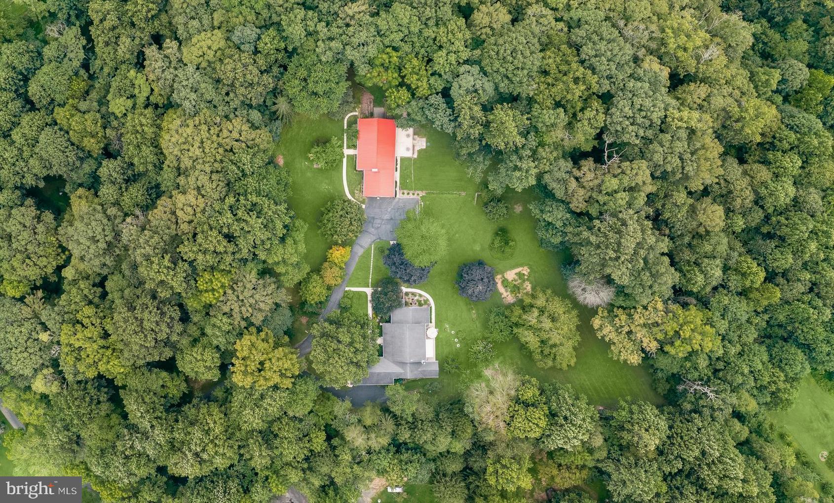 ATTN: THIS PROPERTY IS OFFERED AS PART OF A RARE DUAL-PROPERTY PACKAGE WITH 3160 SANDY HOOK RD- MLS# MDHR2046606 (Tax ID: 1305064325) THIS LISTING HIGHLIGHTS 3158 SANDY HOOK RD, BUT THE FULL VALUE IS REALIZED WHEN COMBINED WITH THE NEIGHBORING PROPERTY. PLEASE SEE THE COMBINED LISTING FOR DETAILS. YOU CAN FIND THE LISTING USING PROPERTY ADDRESS 3160 & 3158 SANDY HOOK RD OR SEARCH WITH MLS# MDHR2046606. THIS IS TRUELY A RARE ONE-OF-A-KIND PROPERTY! PERFECT FOR THOSE BUYERS LOOKING FOR A MULTIGENERATIONAL HOME OR RENTAL OPPORTUNTIES THIS LISTING OFFERS LIMITLESS OPPORTUNITIES!
This is a package deal that includes both 3158 Sandy Hook Rd (Tax ID1305048664) price point $430,000 & 3160 Sandy Hook Rd (tax ID 1305064325) price point $900,000 An extraordinary opportunity awaits with two charming homes nestled together on a combined 6.6 stunning acres.
A welcoming front porch at 3158 Sandy Hook sets the tone as you step inside to a freshly painted interior (2024) in a pleasing neutral palette. The sun-filled living room boasts rich hardwood floors (refinished
June/July 2024) and a striking bay window with a hint of mid-century modern flair, the perfect
spot to experience the colorful change of the seasons. The dining area flows into the
kitchen, which features durable LVP flooring, Formica countertops, a small island with seating,
and all-electric appliances. Down the hall, the primary bedroom offers a unique dual-entry bath
with a shower, accessible from both the primary bedroom and the kitchen. Two additional bedrooms, each
with hardwood floors, and a second full bath completes the main level.
The finished lower level extends your living space with a generous recreation/family room
featuring a decorative fireplace, plus three bonus rooms ideal for a home
office or creative studio space. A laundry room with a washer, dryer, and utility
sink, and storage, along with both interior and walkout access, make this level highly
functional.
Step outside to enjoy a rear patio, perfect for dining or simply watching birds, deer
and other interesting wildlife. The property also includes a separate shed and fenced
areas for animals, an attached 1½-story, 2-car garage with workbench, and plenty of
open and wooded areas to explore.
Practical upgrades provide peace of mind: a standing seam metal roof with new siding
and gutters (2020), air conditioner (2018, 2½ ton, 15 SEER), hot water heater (2021),
upgraded 200-amp electric service with new switches and receptacles, PVC plumbing (2021),
septic replaced with a concrete tank (2007), a new deepened well (2002) and gated driveway with motorized gate that offers enhanced security and convenience.
This move-in-ready home blends the charm of country living but yet only minutes away from downtown Bel Air. Note: Select interior photos have been virtually staged. 3158 Sandy Hook Rd. is being SOLD "AS IS". The sellers have not lived in the home, but it has been well cared for and thoughtfully updated, making it a great opportunity for buyers to add their personal touches.