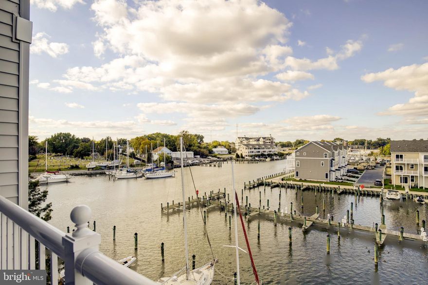 WATERFRONT condo with broad views of Cambridge Creek and resident marina. This unit is meticulous, and is truly turn key, move-in condition! Lots of recent energy saving upgrades and improvements -  including a Rinnai Tankless Water Heater, highly efficient Bosch HVAC unit, SS GE Kitchen appliances, Electrolux Washer & Dryer, Granite countertops with additional depth area for comfortable seating & also tiled backsplash. The first thing that catches your attention when you walk in, is the bright airy living room and the large glass sliding door to your private waterside balcony with gorgeous water everywhere!! You will appreciate this nice third floor unit that has two bedrooms (both facing the water with water views), two full baths, dining room/office with tray ceiling, open airy kitchen with pantry, breakfast bar, room for a small kitchen table AND it's been freshly painted. The spacious  primary suite has a walk in closet and an additional 2nd closet, a roomy primary bath with double vanities & an oversized shower. The guest bedroom also is spacious and has its own walk-in closet as well. This condo is gently lived in with neutral decor. Deep Harbour is a gated community with secure assigned garage parking ( #50), keypad/fob front building entry area and a waterside parking lot for guests. There are several boat ramps nearby - the closest is just outside the DH Trenton Street Gate (total of 31 FREE Boat Ramps in Dorchester County). There is also several parks/playgrounds in Cambridge, Fishing Pier, Arts Centre, Harriet Tubman Museum & Educational Center, the BEAUTIFUL Blackwater National Wildlife Refuge, Dorchester Visitor Center and Long Wharf. Having it all is an understatement.... welcome to the Land of Pleasant Living....The Eastern Shore!!