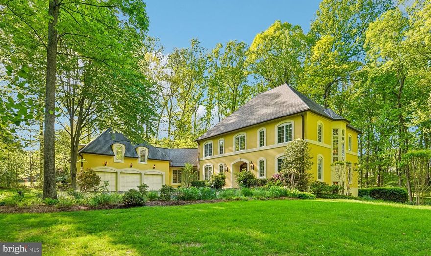 Nestled in the serene enclave of Brighton Pines, this exquisite Country French Colonial-style residence offers a harmonious blend of luxury and comfort, perfect for those seeking an elevated lifestyle. Spanning over 5,100 finished square feet, this meticulously maintained home features five spacious bedrooms and four elegantly appointed bathrooms, ensuring ample space for relaxation and entertainment. Step inside to discover a warm and inviting interior adorned with rich hardwood floors, plush carpeting, and elegant ceramic tile. The heart of the home is the expansive kitchen, designed for both functionality and style, featuring solid surface countertops, a central island, and a cozy table space. The kitchen seamlessly flows into the family room, creating an ideal setting for gatherings. A spacious living room and  formal dining room, complete with crown molding, adds a touch of sophistication for special occasions. Retreat to the primary suite, where luxury meets tranquility. This private oasis boasts a lavish bathroom equipped with a jetted tub, and separate shower, double vanities, and a spacious walk-in closet, providing a perfect escape after a long day. Additional interior highlights include a central vacuum system, recessed lighting, and wiring for you to add your sound system. The fully finished basement is a true gem. A level-walkout, with ample windows that invite natural light. A versatile space that can serve as a recreation area, plus a space for home office, additional living quarters, catering to your lifestyle needs. Outside, the property is equally impressive. Set on a generous 3-acre lot, the home backs to lush trees, offering a sense of privacy and tranquility. Enjoy evenings on the patio, or head up the path to the sport court. Built for basketball and tennis practice against the back wall, a pickle ball court may be easily added. Enjoy the fun of outdoor recreation or a peaceful retreat right in your backyard. Additional exterior features include energy-efficient Anderson double-pane windows, exterior lighting, and an underground garden irrigation system, ensuring your outdoor space remains vibrant and inviting year-round. The oversized attached garage provides ample storage and convenience, with a newly paved driveway leading to your front door and a finished loft/bonus room upstairs. This exceptional property is not just a home; it's a lifestyle. Experience the perfect blend of luxury, comfort, and nature in this stunning Brighton Pines residence, where every detail has been thoughtfully curated for your enjoyment. Clarksville top rated River Hill High School, restaurants and shopping all just a short drive away. Commuters will find easy access to route 32, route 95, and easy driving to Columbia, Rockville, Olney and Silver Spring.