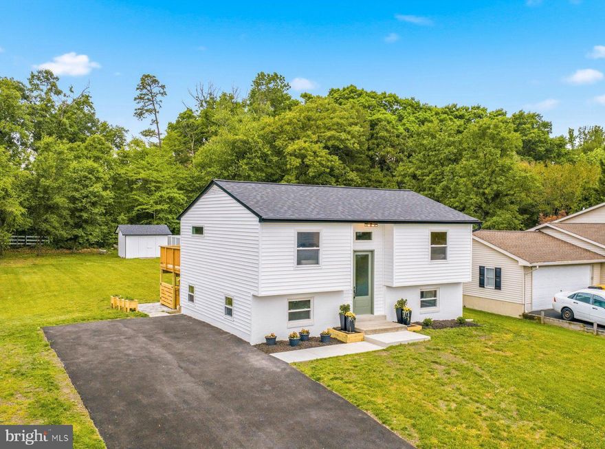Open house from 1pm to 3pm, Saturday May 23rd! Stunning,  Fully Renovated Split Foyer on a Premium Corner Cul-de-Sac Lot in Severn!
Welcome home to this beautifully remodeled 3-bedroom, 2 full bath split foyer that has been thoughtfully updated from top to bottom with stylish finishes & quality craftsmanship throughout. 
Everything has been done for you—featuring a brand-new roof, new siding,  updated exterior doors, newly redone driveway, all new light fixtures, & luxury vinyl plank flooring throughout. The completely renovated kitchen is truly the centerpiece of the home with beautiful updates & all-new appliances, creating a fresh & modern space for everyday living &entertaining.
Both full bathrooms have been completely redesigned with custom luxury finishes, offering a spa-inspired feel. Step outside & enjoy the expansive flat, open backyard, ideal for gatherings, play, gardening, or simply relaxing. The outdoor space includes a fire pit area, storage shed, & a brand-new deck, creating the perfect setting for entertaining year-round. Situated on a generous .369-acre corner lot at the end of a quiet cul-de-sac & Located in desirable Severn. This move-in ready home is just minutes from shopping, restaurants, & major commuter routes while offering the comfort of a tucked-away neighborhood setting. A rare opportunity to own a truly turnkey home with modern upgrades, a large yard, & exceptional outdoor living space! Call today to schedule your showing appointment!