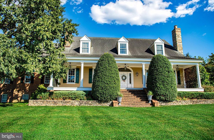 Welcome to 500 Pond View Ln, a stunning Southern Living-inspired estate nestled on over an acre with sweeping views of Hayfields Country Club. This custom-built home boasts 7 bedrooms, 4.5 baths, and over 9,700 sq ft of meticulously crafted finished living space.
Step through the solid walnut entry door into the grand foyer with vaulted ceilings, hardwood flooring, and elegant wainscoting. The formal living and dining rooms each feature wood-burning fireplaces, marble surrounds, and intricate crown molding. The gourmet kitchen is a chef's dream, with custom cabinetry, granite counters, tumbled marble backsplash, twin under counter smart Jenn-Air stainless steel ovens, 6 burner gas cooktop with downdraft vent, and a spacious breakfast room that opens to a covered veranda. Two large peninsula counters offer additional storage a beverage station and ice maker. A large butlers pantry/bar area offres cherry cabinetry, wine racks, and granite counters. A spacious mudroom sits between the pool area and garage with custom built cabinetry, storage bins, and additional dishwasher and sink/wash area. The great room impresses with a coffered ceiling, an oversized stone and brick wood burning Rumford fireplace, and floor-length windows overlooking the serene backyard oasis and covered verandah. Relax in the large main-level primary suite with French doors leading to the veranda, a luxurious updated bath complete with dual vanity, freestanding soak in tub, vaulted ceilings, walk in glass enclosed shower, and a custom built dressing room.
Upstairs, four additional bedrooms provide space for family or guests, each offering unique charm and ample storage. Two additional full bathrooms sit on the upper level as well. The upper level has a large open den currently used as a home office with steps down into a spacious media room. The large media room spans 26 x 26 with vaulted ceilings, built in cherry entertainment center, surround sound and Samsung TV that will convey with the home. Up one more flight of steps is a large finished, conditioned, attic area that can be used as additional flex space or a 7th bedroom.

Entertain in style in the lower level, complete with a recreation room complete with pool table, home gym area, and a large home theater with surround sound. The opposite side of the lower level is perfect for an in law suite and/or multi-generational living. Complete with gas fireplace, living area, sleeping area and full bathroom.
Step outside to find a heated, grotto-style pool, extensive bluestone patios, and a built-in grilling station—perfect for enjoying Maryland’s seasons. This home combines timeless elegance with modern amenities, including a five-zone HVAC, a standby generator, and a Sonos sound system. Don't miss the opportunity to make 500 Pond View Ln your forever home—luxury living at its finest.