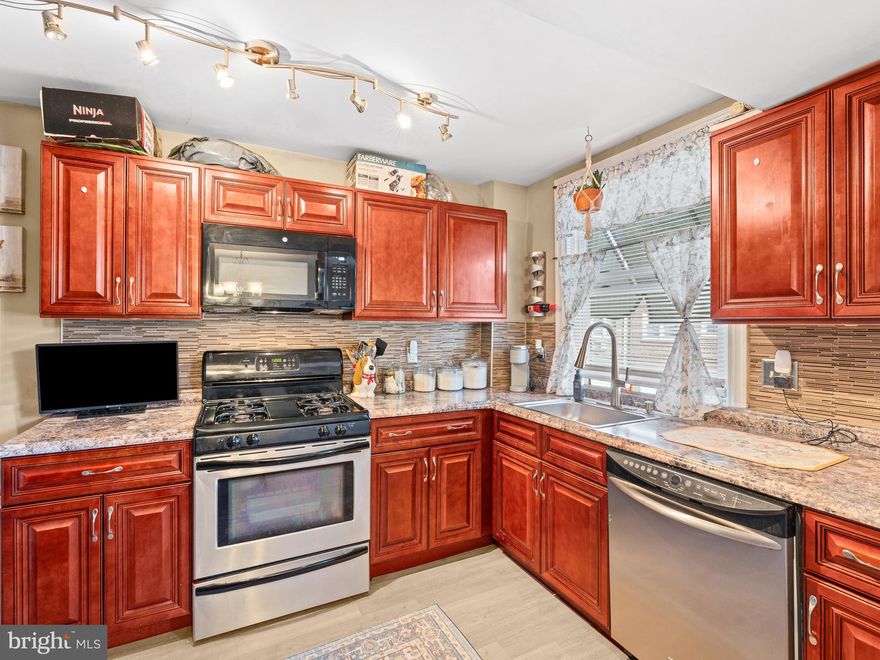 This is a must see! You won't be disappointed! Schedule your appt today! This home exudes pride in ownership.  Enter this gorgeously arranged living room that flows perfectly through to the good size dining room, which is off the beautifully updated kitchen. This lovely home features beautiful hardwood floors throughout. Home has an updated kitchen w/Stainless Steel Appliances, Granite Countertops w/Mosaic Tile Backsplash and Tiled Flooring. This gorgeous 2-bedroom, 2 full bath home is spacious with a large finished basement which could also serve as a 3rd bedroom for family, guest, an office, playroom, etc. and there's a full bath with shower.  Washer & Dryer located in basement. The basement exits to the rear one car parking space. New Roof with 12 yrs guarantee! Close to public transportation, shopping and restaurants.