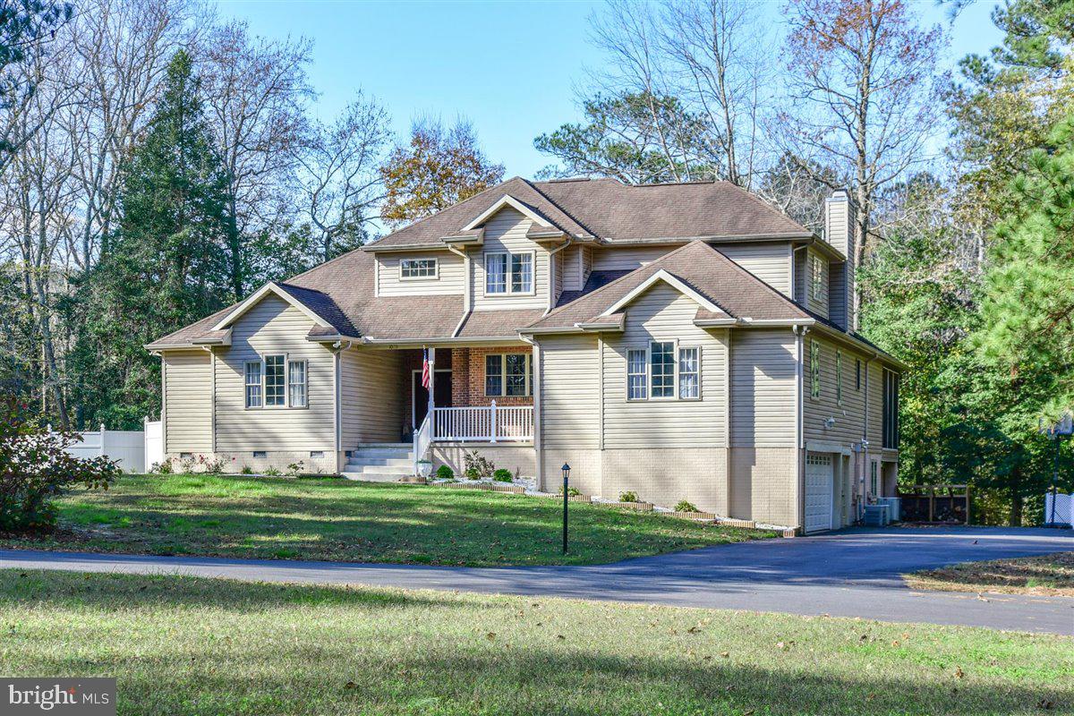 MAJOR PRICE REDUCTION! MOTIVATED SELLERS!  ALL REASONABLE OFFERS CONSIDERED! The Perfect Home For Your Large or Extended Family!  RARE FIND!  OVER SIZED FIRST FLOOR IN-LAW-SUITE WITH FULL KITCHEN, LIVING ROOM & BEDROOM W/ WALK IN CLOSET!  Situated On 2 PRIVATE WOODED LOTS, Almost 2 ACRES IN PINEY ISLAND!  Additional Lot Allows The Extra Room To Build A Private In-Ground Pool w/Bath House  Or Extra Guest Quarters.  Spacious Living & Dining Room Can Accommodate Family & Friends On The Holiday's.  Home Boasts 2 Full Size Kitchens, 5 Bedrooms (First Floor Master Bedroom) Office, Extra Large Bonus Room w/ Separate Entrance, Oversized 2 Car Garage & 2 Family Rooms. Main Level Kitchen Is Off Of The Family Room & Dinette So Your Never Cooking Alone! Family & Friends Can Enjoy The Warmth Off The Wood Burning Brick Fireplace While You Cook Or Can Sit On The Outdoor Deck Or Screened In Porch Off The Family Room.  Master Bedroom Suite Has Walk In Closet, Tiled Separate Shower & Jacuzzi Soaking Tub. Downstairs Is Fully Tiled And A Full Walk Out From Every Door, Has 2nd Full Size Kitchen, Family Room, Full Bath & Bedroom. All  NEW SEPTIC SYSTEM In 2020, Owned Water Conditioning System For Well & 4 Zones For Heat & Air Conditioning So There's Never Any Issues With Comfort.  One Year Home Warranty to Buyers w/Acceptable Offer.   Easy To Show!