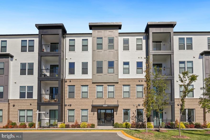 Beautifully appointed 3-bedroom, 2-bath luxury condominium located in the desirable Summit at Birchwood, a premier 55+ active adult community. This nearly new, one-level residence offers approximately 1,850 square feet of thoughtfully designed living space with high ceilings, abundant natural light, and a seamless, open-concept layout ideal for both everyday living and entertaining.  The spacious living and dining areas flow effortlessly into a well-appointed kitchen featuring quartz countertops, a large center island, stainless steel appliances, and tasteful designer finishes. The primary suite provides a comfortable retreat with a walk-in closet and a private en-suite bath, while two additional bedrooms offer flexibility for guests, a home office, or hobby space.  Luxury vinyl plank flooring enhances the main living areas, complemented by premium flooring or carpeting in the bedrooms. Ample storage is found throughout the home, including generous closets, a pantry, and a dedicated utility or storage space. Garage parking is included, with optional additional driveway parking available.  Built with energy-efficient construction, modern systems, and quality finishes, this home offers low-maintenance living without sacrificing comfort or style. Residents of Birchwood enjoy exceptional amenities such as indoor and outdoor pools, walking and fitness trails, bocce and pickleball courts, an active clubhouse with social programming, and convenient access to Brambleton’s shops, dining, community events, and major commuter routes.  An excellent opportunity for buyers seeking refined, single-level living in one of Ashburn’s most sought-after active adult communities.