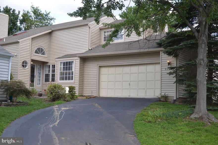 Charming Contemporary with spacious two car garage in sought after Nottingham community of Kingstowne. Two story living room features wood fireplace, 2 BR 2.5 BA with MBR walk in closet. MBA features separate soaking tub and shower. Separate Dining Room with SGD to fenced back yard. Convenient to shopping. Walk to community pool and clubhouse! New siding.