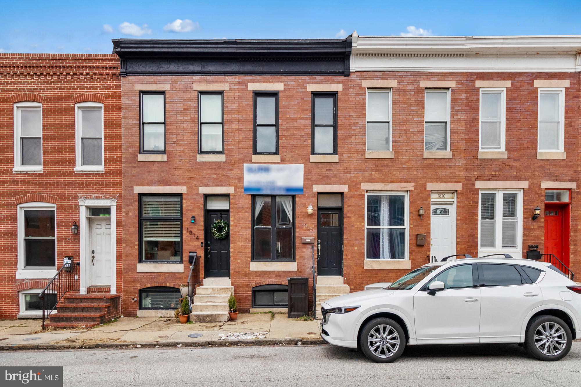 Discover this beautifully renovated Federal Hill gem featuring three finished levels and 2+ car parking! Enjoy hardwood floors throughout the upper levels, a spacious living room with exposed brick, and a separate dining area. The designer kitchen boasts granite counters and stainless steel appliances. Retreat to the master suite with a full bath and private rear deck. A second bedroom shares a hall bath, while the finished basement offers a third bedroom and full bath. With an oversized parking pad and just steps from Federal Hill’s vibrant restaurants, this home is a perfect blend of comfort and convenience!