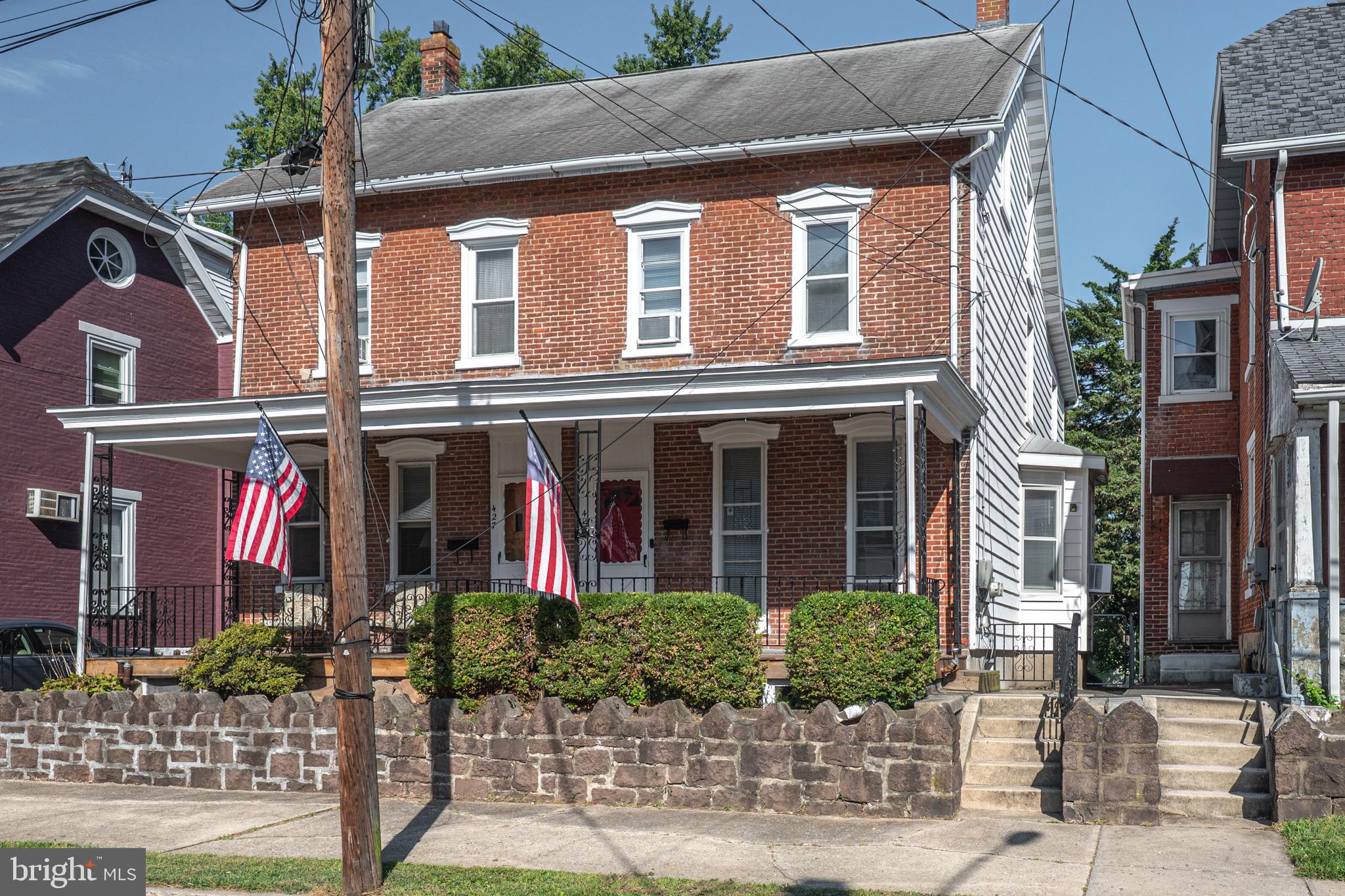 An All American Colonial Brick Twin with a Classic Covered Porch Setting rests at the peak of Church Street in the heart of Up and Coming Royersford Borough & Spring-Ford School District. The period stonewall with mature shrubbery, iron railings, relaxing front porch, and those long front windows captures your attention upon first impression. Upon entry of 429 Church Street, the ample natural lighting from the morning sun brightens the light tones of the main floor and grazes over the brand new Luxury Vinyl Plank Flooring throughout. The spacious living/dining combo provides layout options for your lifestyle or home vision. The traditional dining area may be better suited as work space by the classic three window bay as table space is offered in the massive kitchen on the rear of the home. A renovated full bathroom on the main floor offers versatility as a necessary full amenity in today's lifestyle needs. The updated kitchen has great natural light from both the rear passthrough enclosed porch and over the sink windows. The modern two tone painted cabinets, trendy patterned tile flooring, and crisp white wainscoting compliment the large kitchen space nicely. Another lifestyle need is a main floor laundry which is offered through the sliding barn door off the kitchen. The enclosed rear porch area offers a functional transition to the rear fenced yard with patio setting and fire pit. The manageable rear yard is a wonder setting for expanded hosting options, covered patio relaxation, and pet needs. The second floor of the home boast newer carpeting throughout the 3 spacious bedrooms, hallway, and staircase. The fully remodeled bathroom features modern tub/shower with tile surround, vinyl plank flooring, crisp wood trim, and new vanity. Expanded living options are on the spacious 3rd floor of the home offering two sizable rooms with painted wood floors. You may choose to finalize a fourth bedroom option with bonus room, closet, or even private office space. The clean unfinished basement offers walkout egress for storage options, mechanical access, and a new oil tank was recently installed. This classic expansive brick colonial in the heart of Royersford is one block off the core of Main Street's commercial district featuring famous local breakfast spots and growing business opportunities. The Schuylkill River Trail is accessible right at the base of town and convenient access to routes 422, 724, & 23. Please join us for our Open House 9/6/2025 to discover why 429 Church Street shows like HOME!
