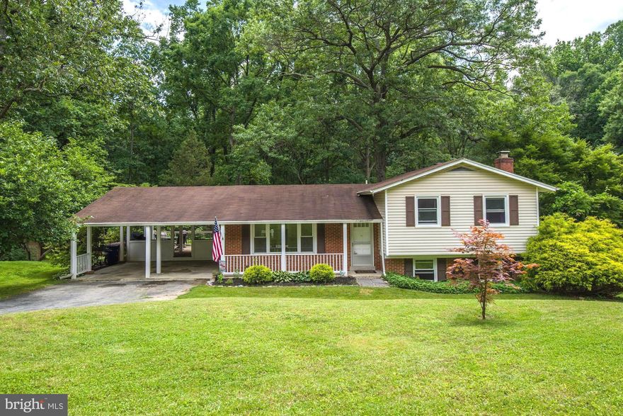Offers due Mon 6/24 by 8PM. Incredible 4-bed 2.5-bath split-level home in an idyllic setting on cherry tree lined cul-de-sac in Seneca Creek Estates. Enter to gleaming hardwood floors throughout. Spacious, open floorplan is highlighted by large windows with views of lush surrounding greenery. Updated kitchen boasts ample cabinet space, sparkling granite counters, central island, and upgraded, all-black appliances. Luxurious master suite is comfortable and welcoming with large closet space and updated full bath. Perfect guest bedroom on lower level with recently-added half bath. Cozy up by wood fireplace, or relax on expansive, Ipe wood deck (highly resistant to the elements) overlooking massive, fully invisibly fenced 0.83 acre lot backing to Seneca State Park. The private, wooded yard with stone fire pit is perfect for entertaining year-round! 2-car carport plus driveway parking. Enjoy a solitary 5-min walk to Clopper Lake right in your backyard, plus easy access to Kentlands, shops, eats, Great Seneca Hwy, I-270, and more. Diamond ES District. Opportunities like this don't come often!