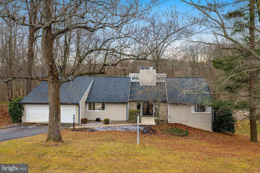 OPEN HOUSE SATURDAY 1/31 FROM 1-3! Extremely rare opportunity in the highly sought-after Glenwood community! This striking contemporary home with approx 3000 sq ft of finished space- is filled with bold architectural design and modern touches throughout, offering a one-of-a-kind living experience that is seldom available in Bel Air.

The main level features rich ebony-stained hardwood floors and an open, airy layout anchored by a sleek, modern kitchen with a large triple window, oversized island, granite countertops, stainless steel appliances, and a built-in pantry. The dining area has space for a long table to easily seat 10-12- (current dining room table could convey!). The family room has a dramatic wall of glass sliders, vaulted ceilings,  and one of two wood-burning fireplaces that rises two stories high, creating a true architectural focal point.

A versatile open flex space off the family room offers endless possibilities—ideal for a media room, music room, additional family room, or frame for a potential fifth bedroom-- and also has built-ins to display your fun home decor!

The primary suite is a true retreat, featuring private access to the rear patio, a large walk-in closet, and a recently remodeled spa-inspired bath with a freestanding soaking tub, walk-in shower, dual vanities, and heated floors.

The rest  of the bathrooms showcase custom tile work and modern vanities, carrying the home’s cohesive contemporary design throughout.

The lower level also offers approx. 8 and 9 foot ceilings, stained concrete floors, a spacious recreation room with sliders leading to the rear patio, and a large laundry and storage room—perfect for everyday functionality and entertaining alike.

Outdoor living at 129 Duncannon Rd is exceptional. The expansive deck features a warm, modern gray–toned stain with a stylish boho influence, accented by sleek cable railings that create a clean, contemporary finish while overlooking breathtaking wooded views with a peaceful creek setting. The natural surroundings provide a serene backdrop for entertaining, relaxing with a book, or simply enjoying the outdoors. A treehouse, tire swing, and ninja-warrior-style tree stump jumping activity trail convey, adding to the unique lifestyle this property offers.

Additional features include recently updated: siding, roof, seamless black gutters. Hot water heater end of 2024- Two-car oversized garage with built in work benches and a floored loft style attic for additional storage. Loft area has unique potential for additional finished space.

All of this is just minutes from downtown Bel Air’s shops and restaurants, Wegmans, and convenient access to I-95. A truly distinctive home offering modern design, natural beauty, and an unbeatable location—this is a rare opportunity not to be missed! No HOA!