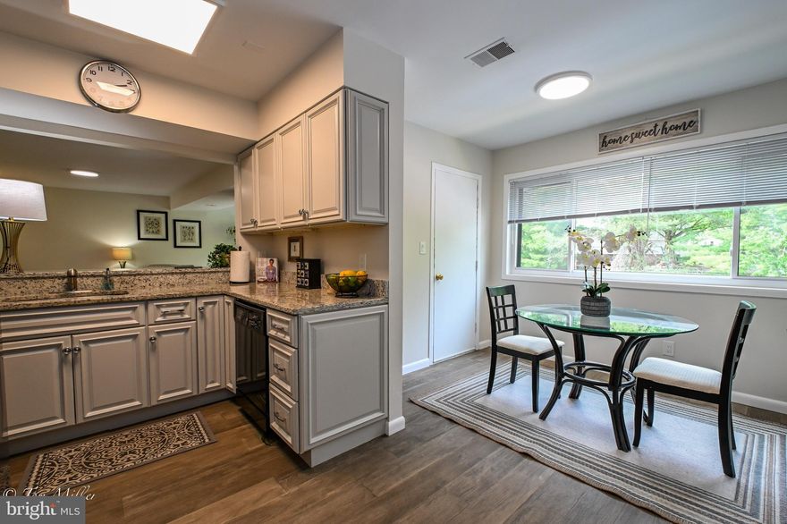 This Gorgeous & RECENTLY UPDATED, 2 Bedroom, 2.5 Bath, 2 STORY Top Level CONDO with almost 1400 sq. ft., is conveniently located off Falls Rd and Old Pimlico and is LESS THAN $250,000!!! You aren't going to want to miss touring this incredible property! The Main Level OPEN Living Room has Sliding Door access to the Deck and is open to the Kitchen with Pass-through and Counter Height Seating. The Kitchen has Granite Counters and Stainless Steel Appliances, a Fabulous Breakfast Room with 2 Pantries and Separate Door access to the Deck. A Half Bath and Laundry/Utility Room are also located on the Main Level.  The Upper Level has Fabulous Vaulted Ceilings in both the Spacious Primary and 2nd Bedrooms. The Lovely Primary 2-Room Ensuite Bath features Awesome Double Sinks and Quartz Counters. The Full Hall Bath has a Terrific Tub/Shower Combo with Subway Tile. NEW LVP Flooring & Fresh Paint Throughout! Not to be missed! Schedule a Showing Today!