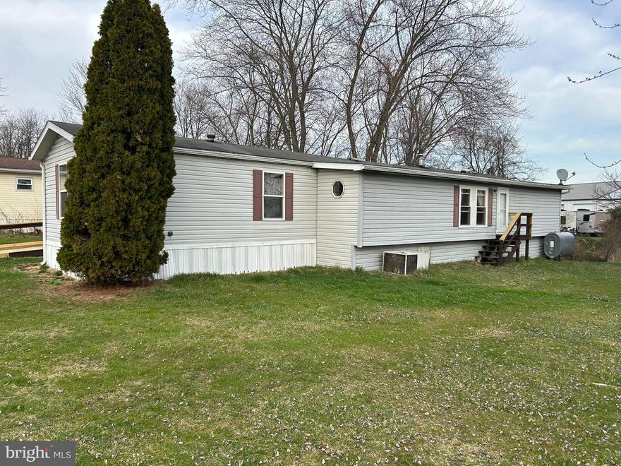 SINGLE WIDE MOBILE HOME WITH ADDITION located in Round Top Mobile Home Park.  This home is larger than it looks the addition increases the size of the main bedroom, dining area, and living room.   Featuring 3 bedrooms, 1 1/2 baths, newer windows, 2-yr old oil furnace, and new entry ramp to front porch.  Access to the community pool at the next door campground along with the social events at the campground for your summer time enjoyment.