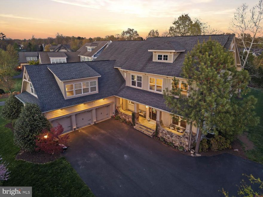 Welcome to this beautifully designed Saranac home set on a flat, tree-lined lot, offering the perfect balance of privacy, space, and functionality. From the moment you arrive, you’re greeted by a large driveway, a 3-car garage, and a charming covered stone front porch that creates a warm and inviting first impression.
Step inside to discover 10-foot ceilings, elegant chair rail molding with wainscoting, and architectural columns that add character throughout the main level. The foyer opens to a formal sitting area, a private main-level office, and an oversized dining room featuring large windows overlooking the backyard and a French door that leads directly outside—creating a seamless indoor-outdoor flow ideal for entertaining.
The heart of the home is the expansive open-concept living area, where the kitchen, family room, and sunroom come together effortlessly. The chef’s kitchen is built for hosting, featuring two large islands, light cabinetry, a striking brick backsplash, stainless steel appliances, a gas range, two sinks, two dishwashers, and two ovens, along with abundant natural light from a large front-facing window. Just off the kitchen, the sunroom provides the perfect casual dining space with walls of windows and a central light fixture.
The family room is spacious and inviting, complete with coffered ceilings, a stone-surround gas fireplace with mantle, built-in shelving, and direct access to the deck—making it ideal for gatherings both large and small. From here, step outside to a thoughtfully designed backyard featuring a spacious deck that leads down to a stone patio, a built-in round stone fireplace, and a pergola seating area—all surrounded by mature trees for added privacy. With multiple access points from both the dining room and family room, this outdoor space is perfectly designed for entertaining.
Additional main-level highlights include a well-equipped mudroom with built-in storage, bench seating, sink, and access to both the garage and exterior, as well as a versatile bonus room perfect for a second office, craft space, or flex use.
Upstairs, each bedroom features its own en-suite bathroom. The primary suite is a true retreat, entered through double doors and offering a spacious layout with a sitting area, tray ceilings, and large windows. Two walk-in closets—one with custom built-ins—provide ample storage. The spa-like primary bathroom includes a soaking tub, dual vanities with a dedicated makeup area, a large glass-enclosed shower with dual shower heads and built-in benches, and a private water closet.
At the end of the hall, an oversized bedroom with private stair access to the kitchen/mudroom area offers the perfect setup for an au pair or in-law suite, complete with its own full bathroom. A conveniently located upper-level laundry room adds to the home’s thoughtful design.
The fully finished basement is an entertainer’s dream, featuring a custom bar with wood paneling and a stone accent wall, a full bathroom, and an additional room ideal for a home gym, media space, or guest area.
Located in one of Gainesville’s most desirable waterfront communities, residents enjoy access to lakeside trails, fishing spots, firepits, campsites, a community pool, and more—all just minutes from top-rated schools, shopping, dining, and major commuter routes.
This home truly offers the space, layout, and setting designed for both everyday living and exceptional entertaining. Schedule your private tour today.
