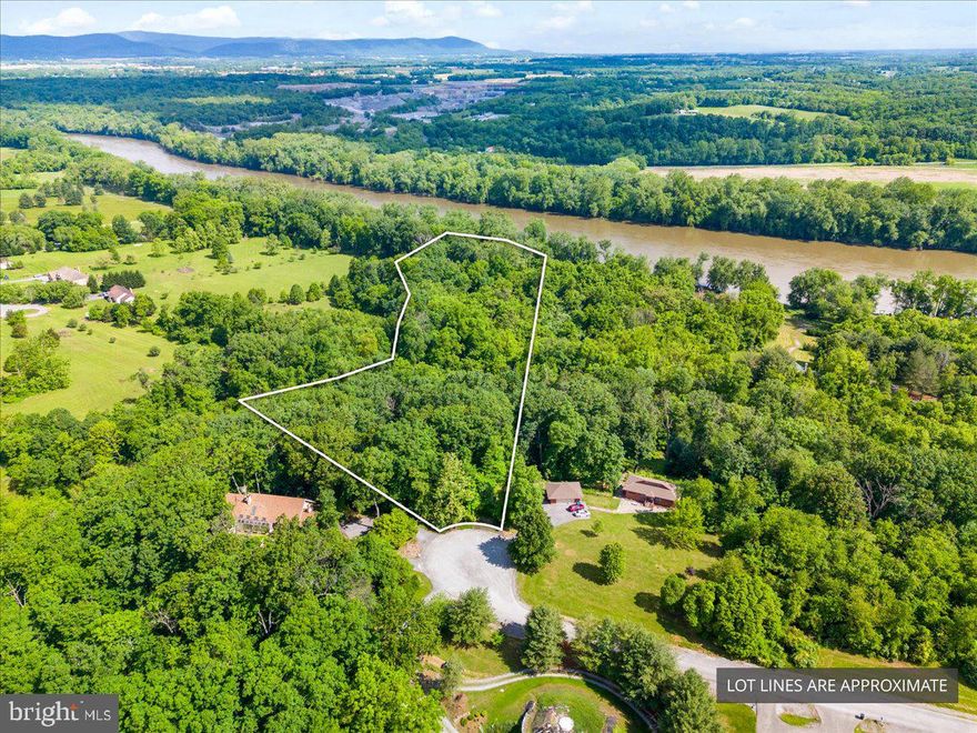 8.26 Acres in Kingsbrooke on the Potomac – A Rare Opportunity for anyone and everyone. Discover the perfect blend of natural beauty, privacy, and potential in the waterfront community of Kingsbrooke on the Potomac, located in scenic Falling Waters, WV. Tucked away at the end of a quiet cul-de-sac, this expansive 8.26-acre lot offers a unique opportunity for someone looking to build their dream home. The property is buildable, with plenty of space for a custom home and outdoor amenities. Meandering walking trails and peaceful creeks lead you straight to the Potomac River, whether it’s your forever home or just a haven in your downtime, this property is for nature lovers and a dream setting for anyone to explore and  enjoy year-round. Whether you're planning your next move or building your investment portfolio, this land offers unmatched versatility, charm, and long-term value. All nestled in a well-maintained subdivision with the added bonus of riverfront access just steps from your door.