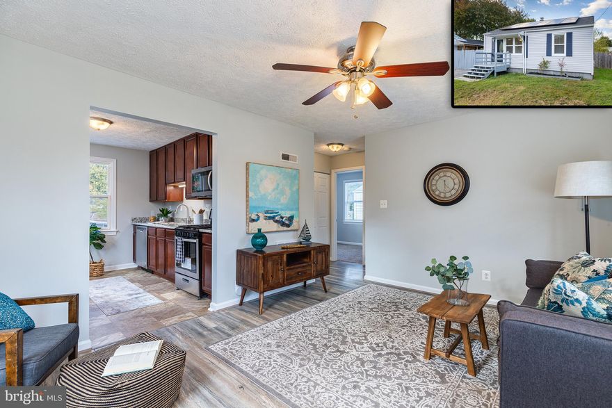 Picture Perfect Ranch Style Home On A Quiet Street! Enter into a bright and airy living area that flows into a beautifully updated kitchen with custom cabinetry, stainless steel appliances and granite countertops.  Down the hall you will find an updated bathroom and two generously sized bedrooms.  This house has been freshly painted and has all new flooring throughout.  Outside is a very large deck overlooking a private fenced in back yard which is perfect for relaxing or entertaining.  This property also has fully paid solar panels installed that originally cost approximately $20,000 and will save you approximately $50 every month!  Property is vacant and easy to show so schedule your showing today!