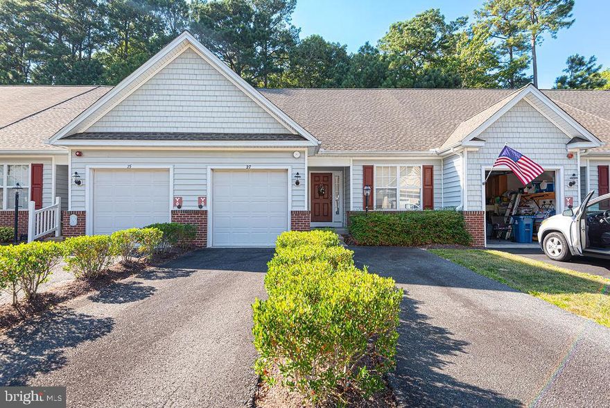 Live your best years in The Parke of Ocean Pines, the Premier Plus 55+ community known for its charm and amenities. This updated 2-bedroom, 2-bath Avocet villa was designed for easy living, with hardwood floors throughout, a stylishly remodeled kitchen, and a sun-filled open layout perfect for gatherings or quiet mornings at home. A stunning sunroom that stretches across the back of the house, featuring wall-to-wall windows, vaulted ceilings, and panoramic views of  a natural wooded area. The primary suite is your retreat with a spacious walk-in closet and spa-like bath featuring dual sinks and a seated shower. Modern updates—newer roof, HVAC, hot water heater, and an encapsulated crawl space for lasting protection and energy savings—mean comfort and confidence for years to come. A one-car garage and two separate driveways add convenience, while negotiable furnishings make moving in effortless.
Beyond your door, enjoy the amenities of The Parke: clubhouse, indoor 55 foot heated pool, fitness center, shared library,  walking trails, and all the vibrance of the Ocean Pines community—just minutes from the Ocean City beaches.