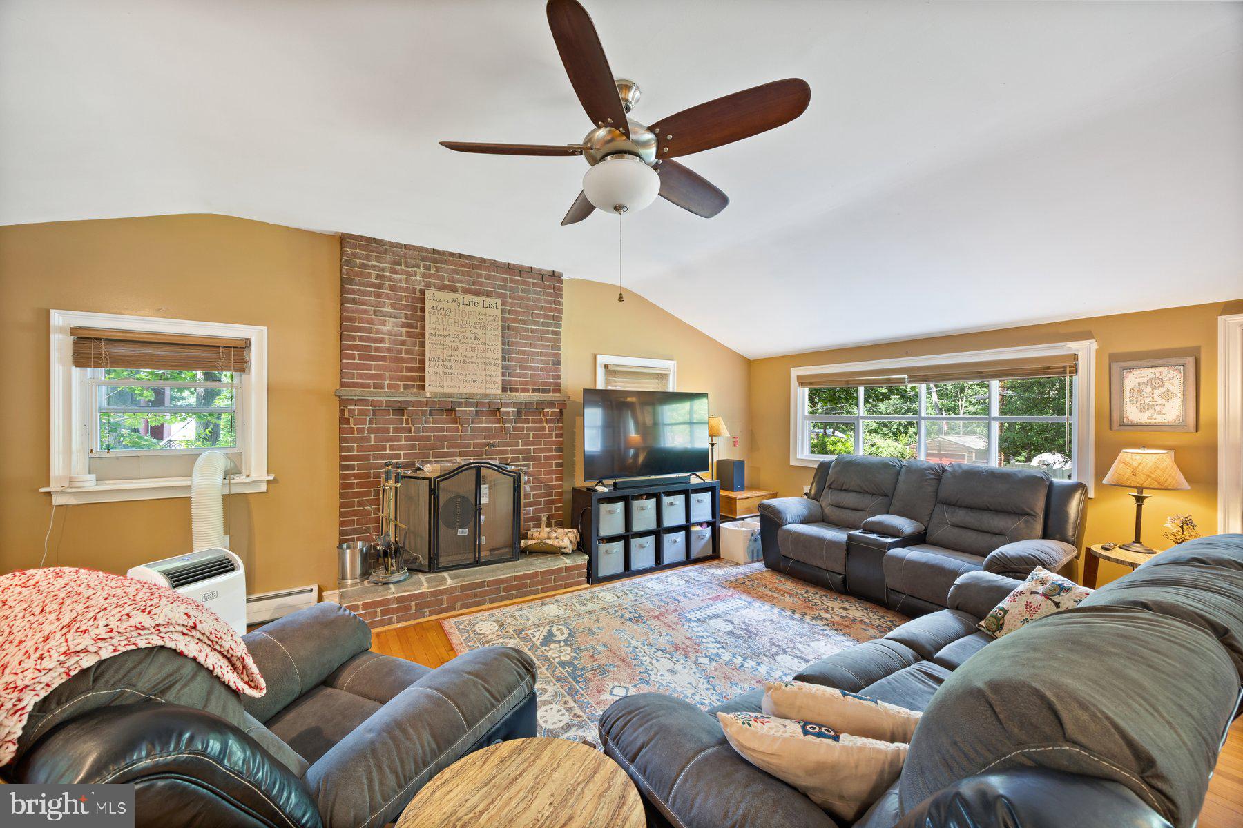 Beautifully maintained and move-ready 3BR/2.5BA expanded home located on a spacious lot in the quiet neighborhood of Cape Saint Claire. Parking is just steps from the front door into your forever home. Step into the main floor living space boasting tons of natural light, vaulted ceilings, hard wood floors, and an open floor plan. The main floor features a large family room with a brick wood burning fireplace, a spacious dining area, a half bath, and a stunning kitchen. The kitchen features beautiful wood cabinets finished with crown moldings, high-end stainless steel appliances including an electric cooktop and a wall oven, beautiful granite countertops, a double stainless sink under a window, and an island with a raised breakfast bar. Make your way to the second floor featuring two primary sized bedrooms with hardwood flooring, and a full bath. On the lower level is the third bedroom, a full bath with a large walk-in shower, storage, and laundry. From the main floor step outside to a large wood deck that overlooks a yard filled with green space, landscaping, adult trees, and two sheds. This home is move-in ready with so much to offer new homeowners and is located in close proximity to shopping, restaurants, and commuter routes.